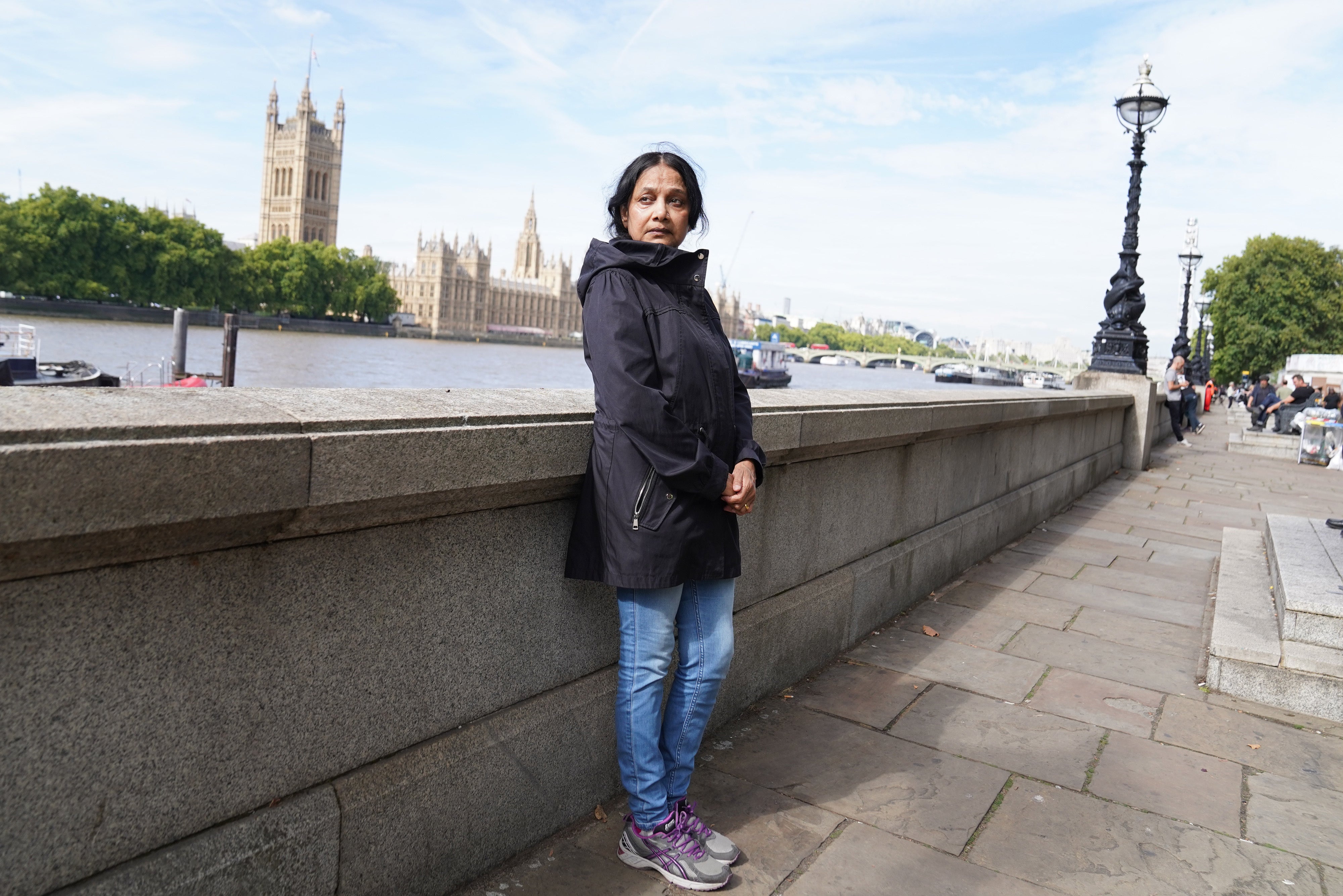 Vanessa Nathakumaran, 56, from Harrow, is the first person to arrive on Lambeth Bridge (Stefan Rousseau/PA)