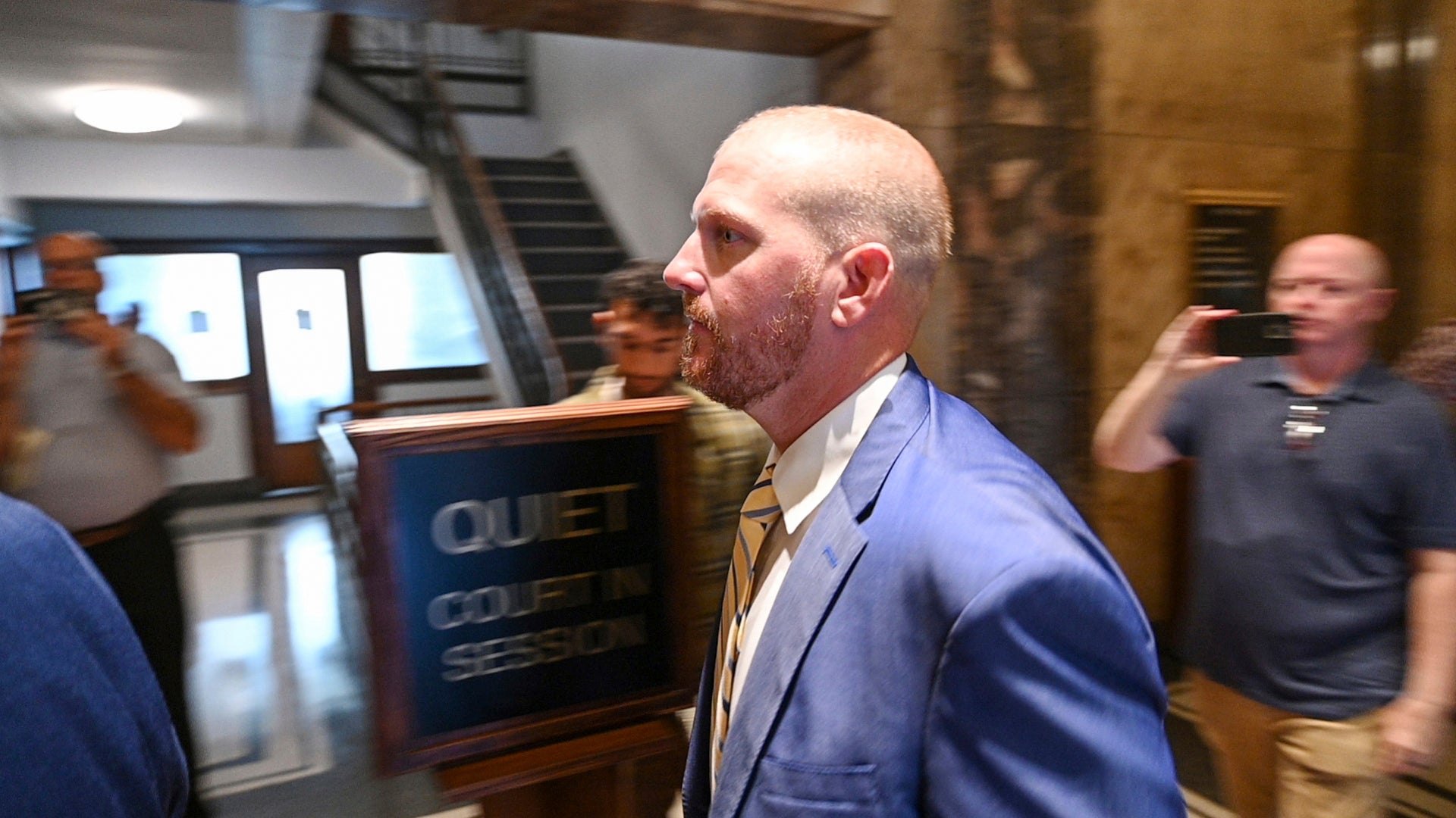 Former Kansas City Chiefs assistant coach Britt Reid walks to a courtroom at the Jackson County Courthouse, Monday, Sept. 12, 2022, in Kansas City, Mo. Reid pleaded guilty to driving while intoxicated resulting in serious physical injury after his truck hit two parked cars in 2021 and severely injured a 5-year-old girl.