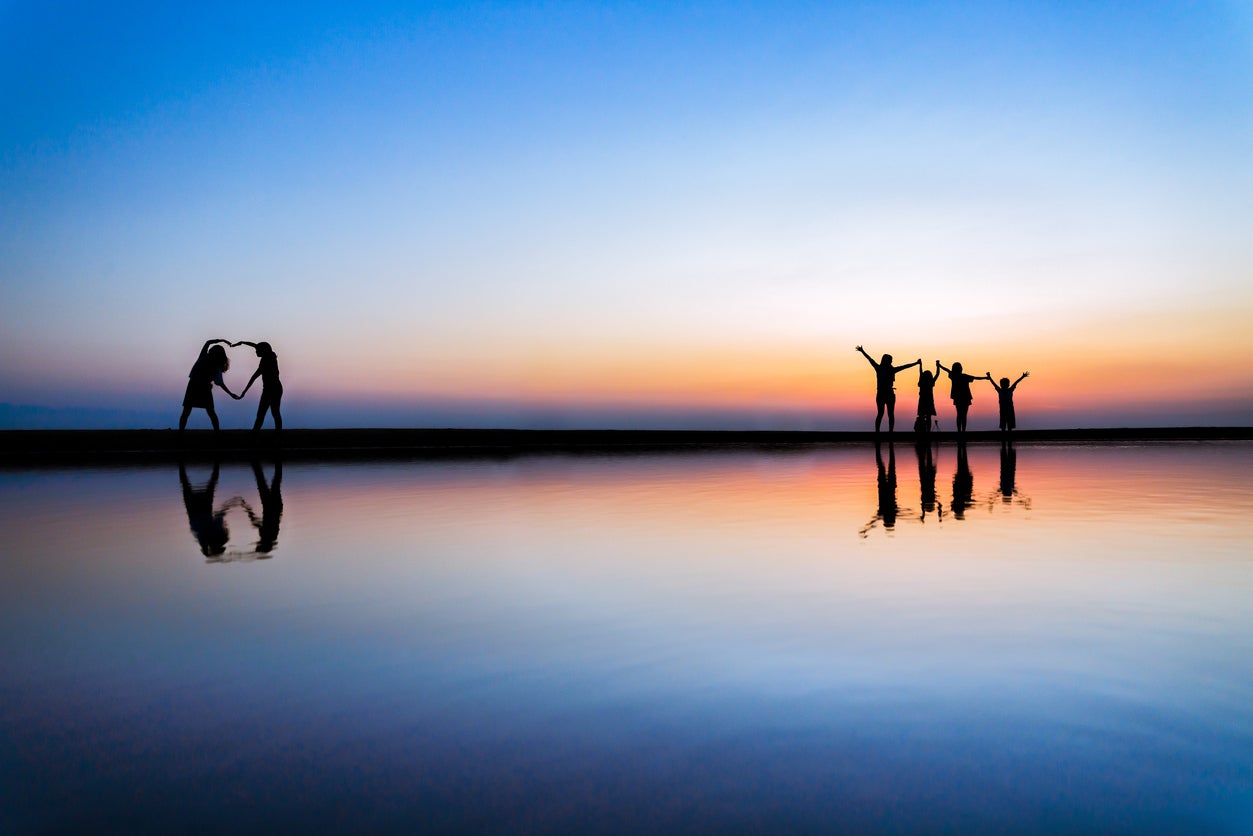 Travellers posing at Chichibugahama Beach in Mitoyo, Japan