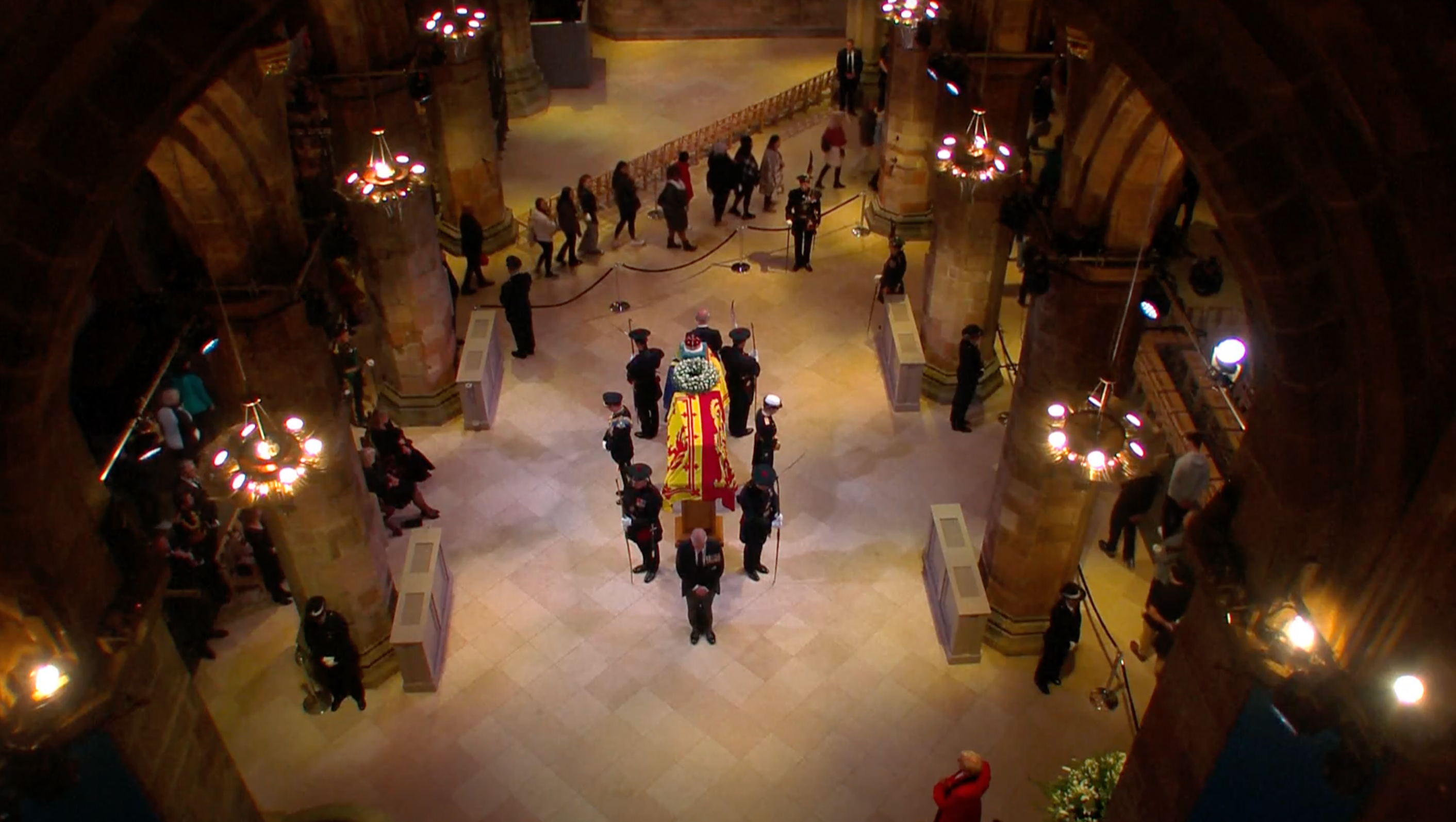 Late Queen’s children stand watch over her coffin as mourners file past