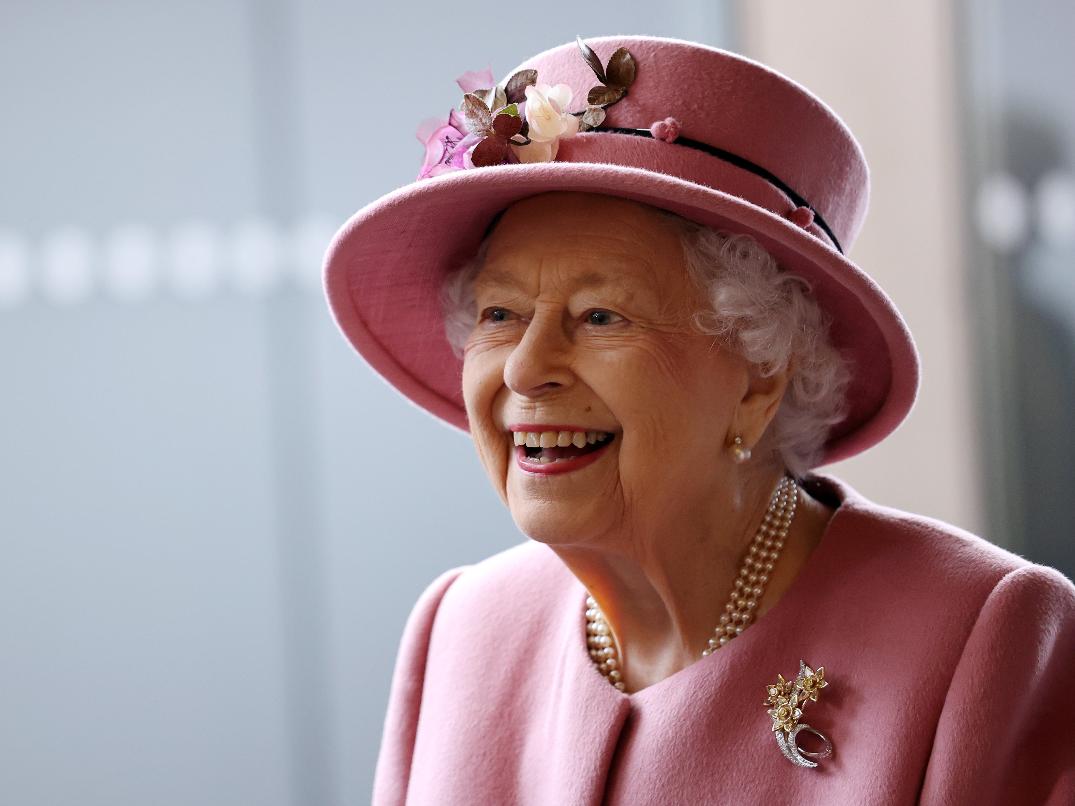 Queen ‘happy playing cards alone’ during social engagements, says Theresa May