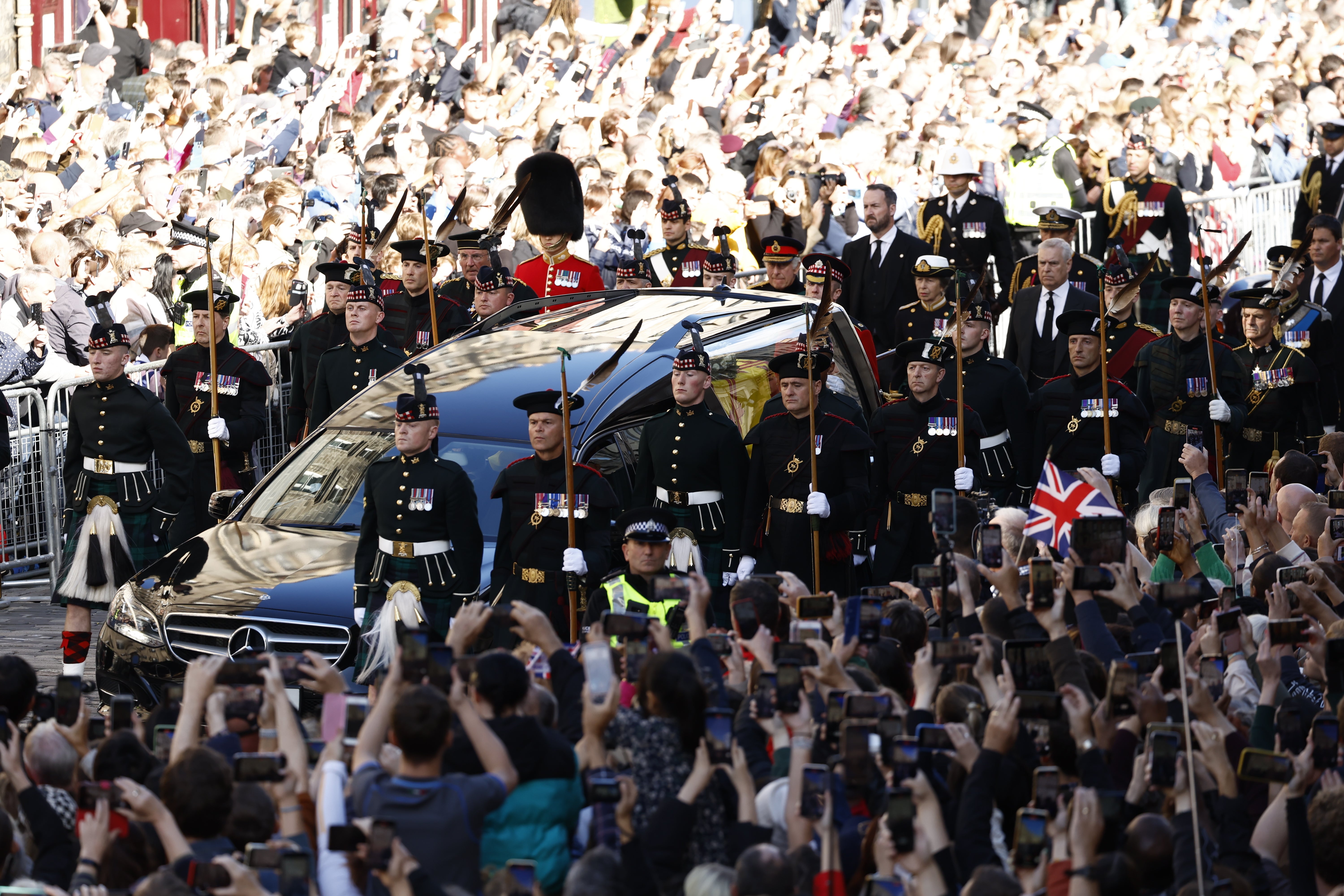 Tens of thousands of people packed out the Royal Mile to watch the procession on Monday