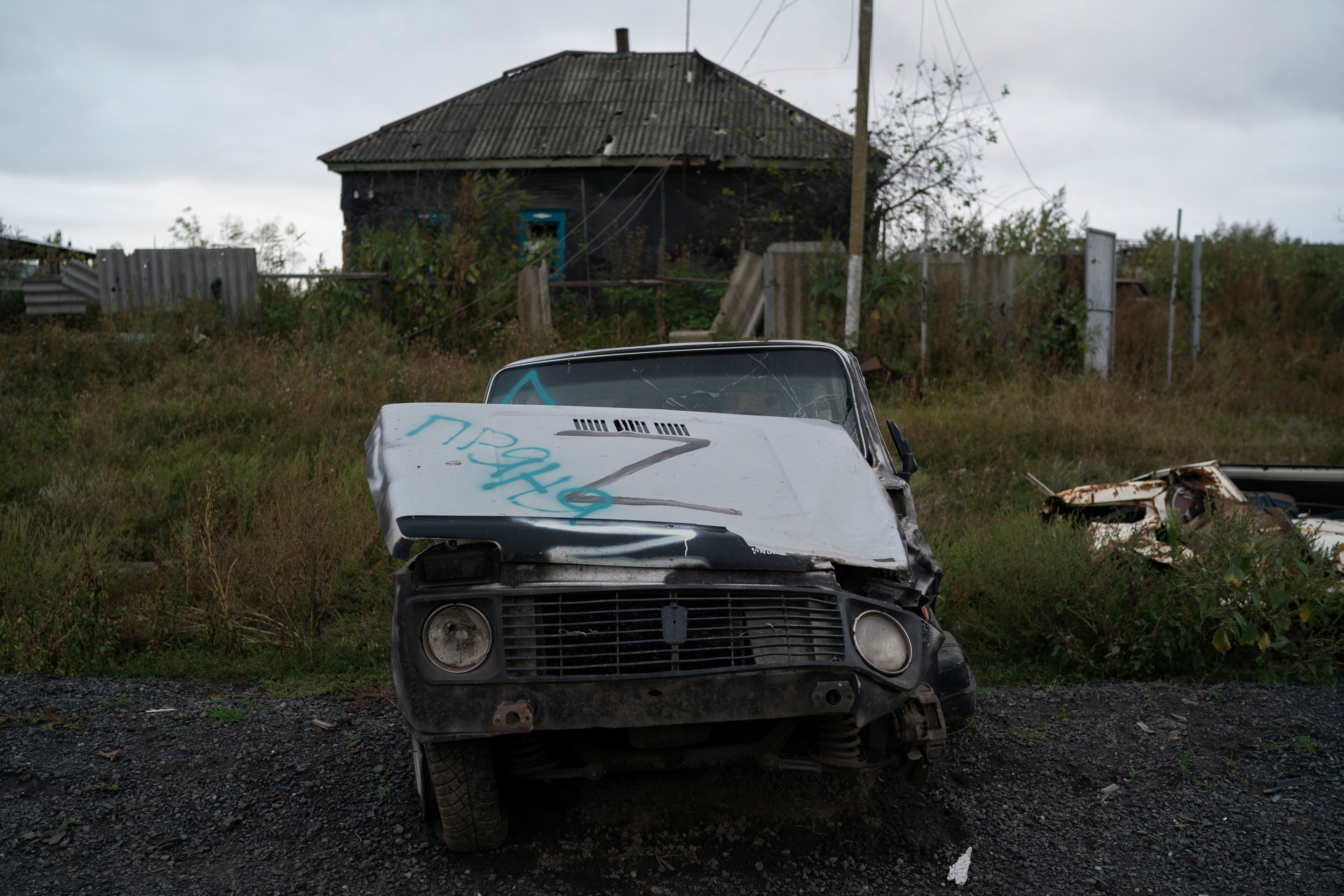 The letter Z, which has become the Russian emblem for the war, is seen on a damaged car in the freed village of Hrakove, Ukraine (AP Photo/Leo Correa)