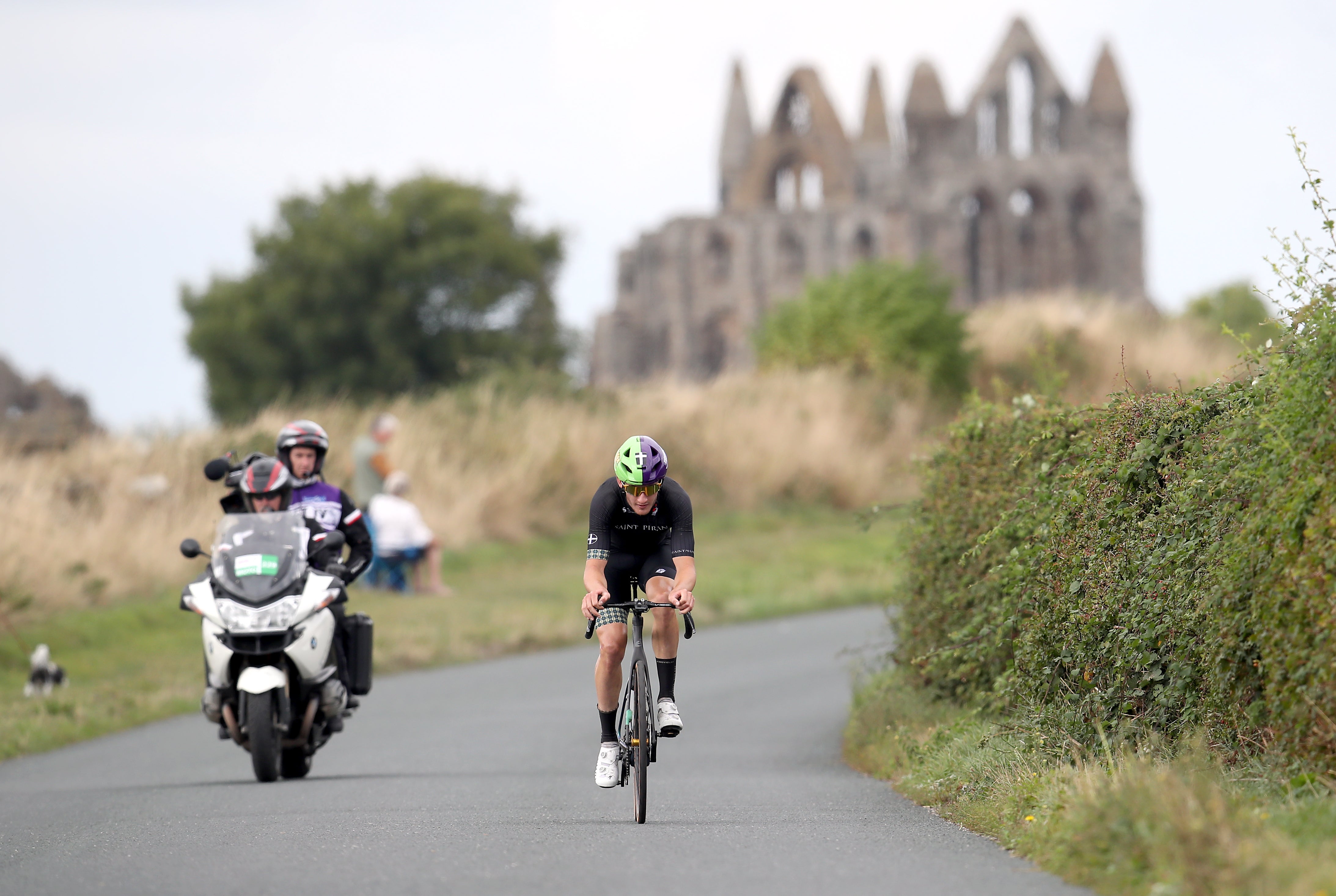 Saint Piran’s Harry Birchall passes Whitby Abbey on stage four of the Tour of Britain (Simon Marper/PA)