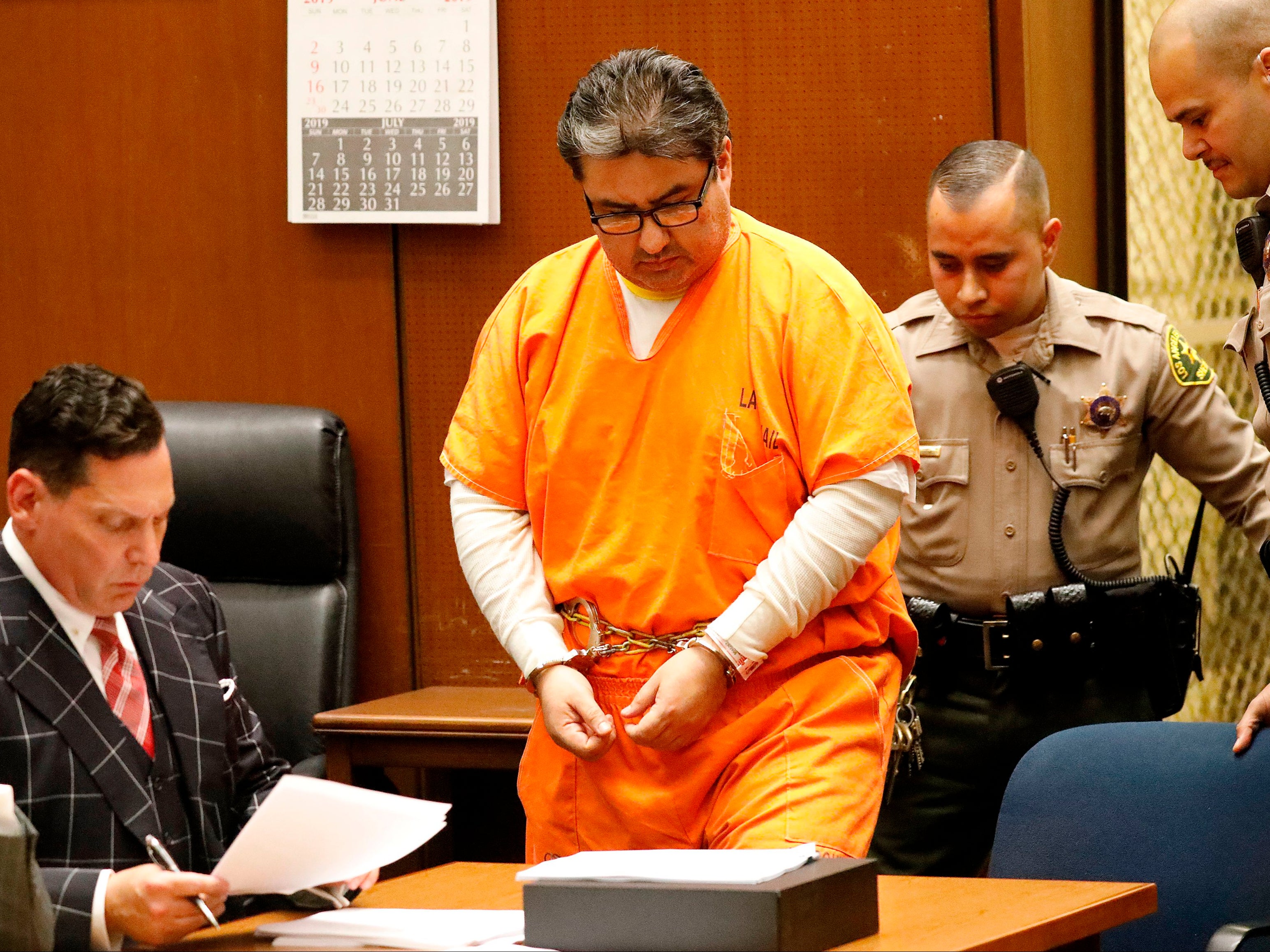 Naasón Joaquín García, the leader of a Mexico-based evangelical church with a worldwide membership of more than 1 million appeared with his defense attorneys Ken Rosenfeld (left) and Allen Sawyer (off frame) for a bail review hearing in Los Angeles Superior Court on 15 July 2019