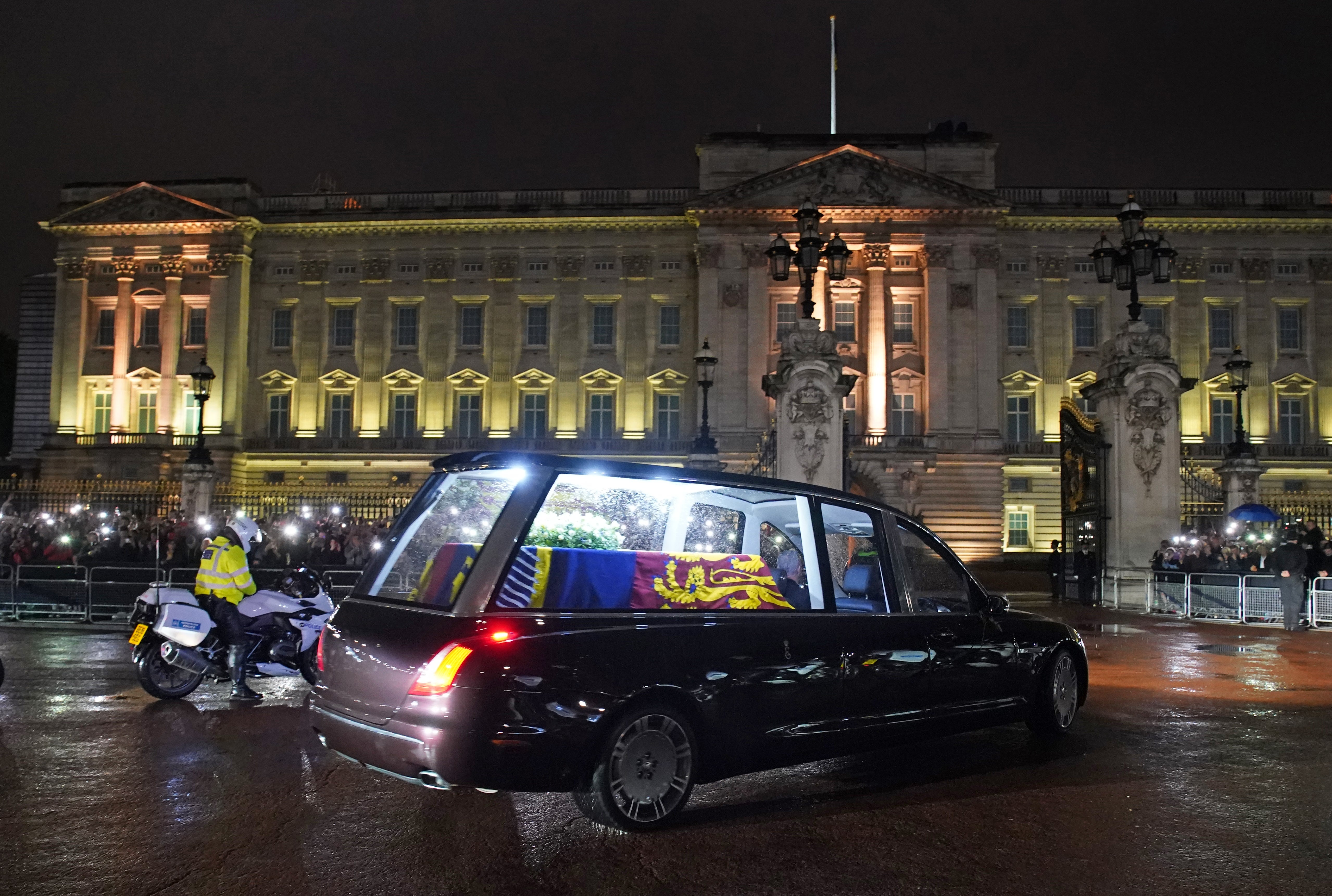 The hearse carrying the coffin of the Queen arrives at Buckingham Palace on Tuesday (Gareth Fuller/PA)