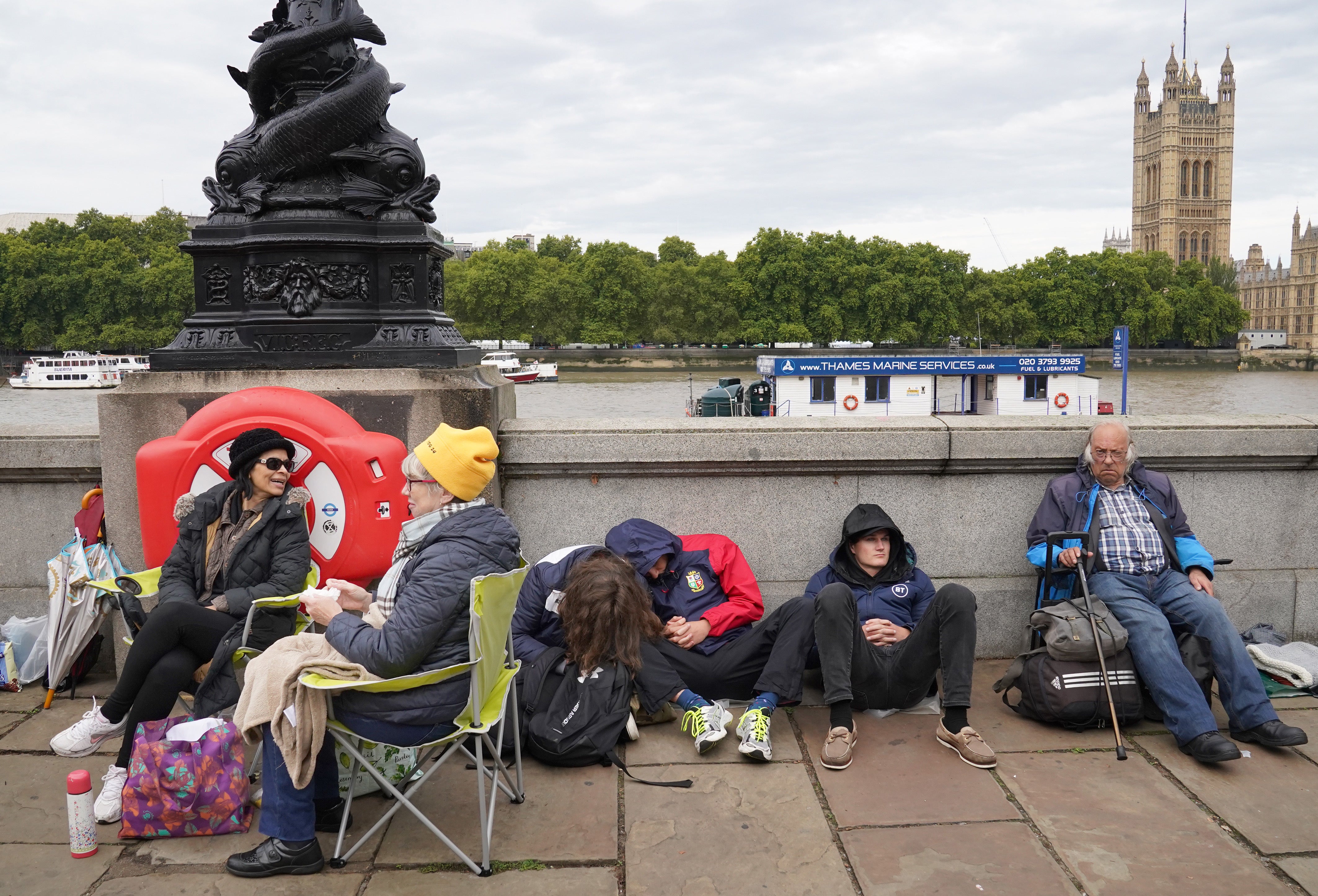 You may find yourself queuing through the night to see the Queen’s coffin (Stefan Rousseau/PA)