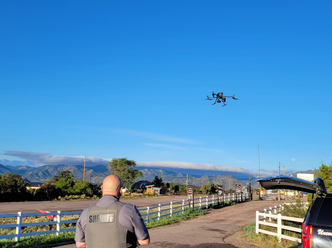 A deputy with the Fremont County Sheriff’s Office flies a drone, which was used to locate a missing golden retriever on Sunday