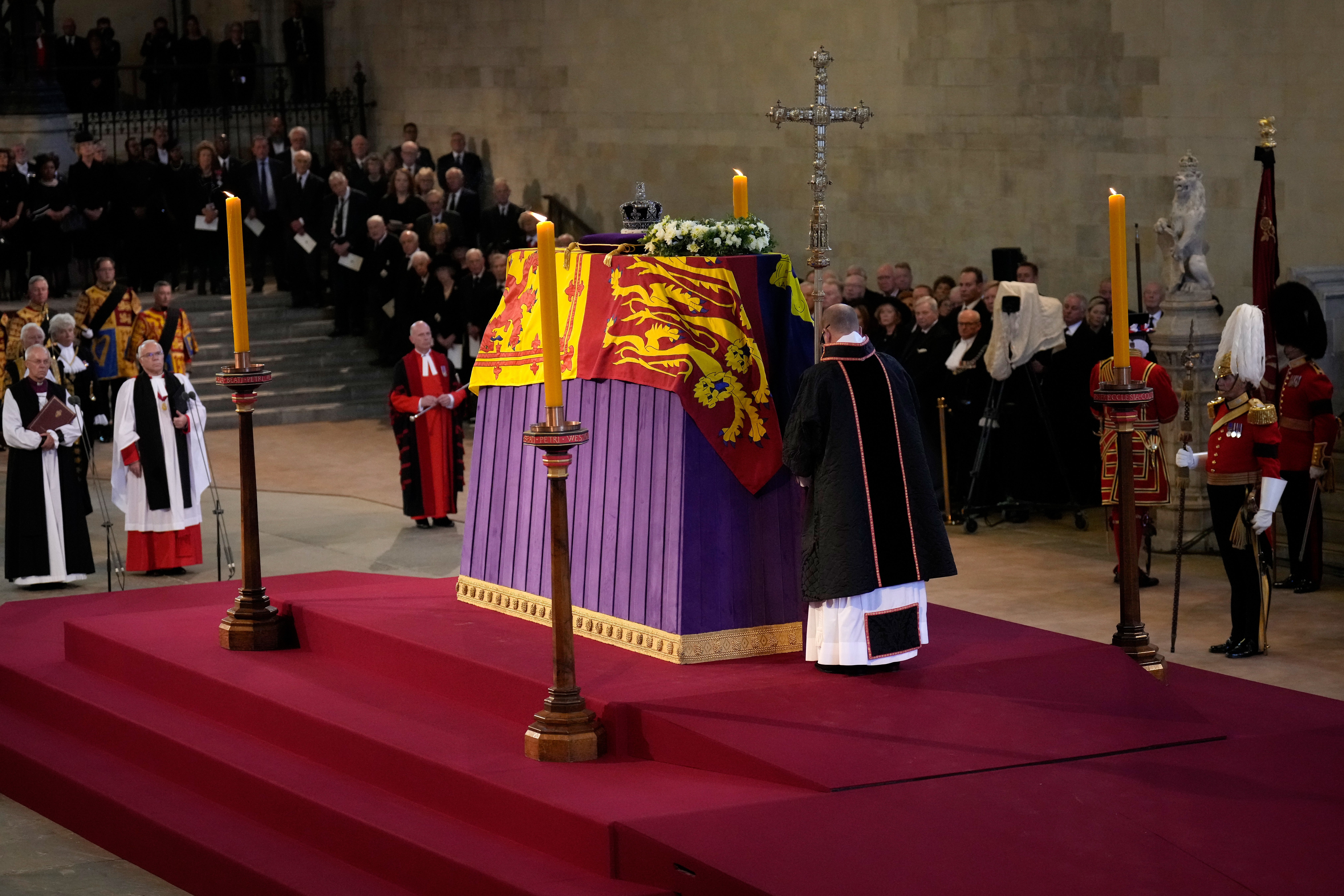 The coffin of Queen Elizabeth II, draped in the Royal Standard with the Imperial State Crown placed on top, lays on the catafalque in Westminster Hall (PA)