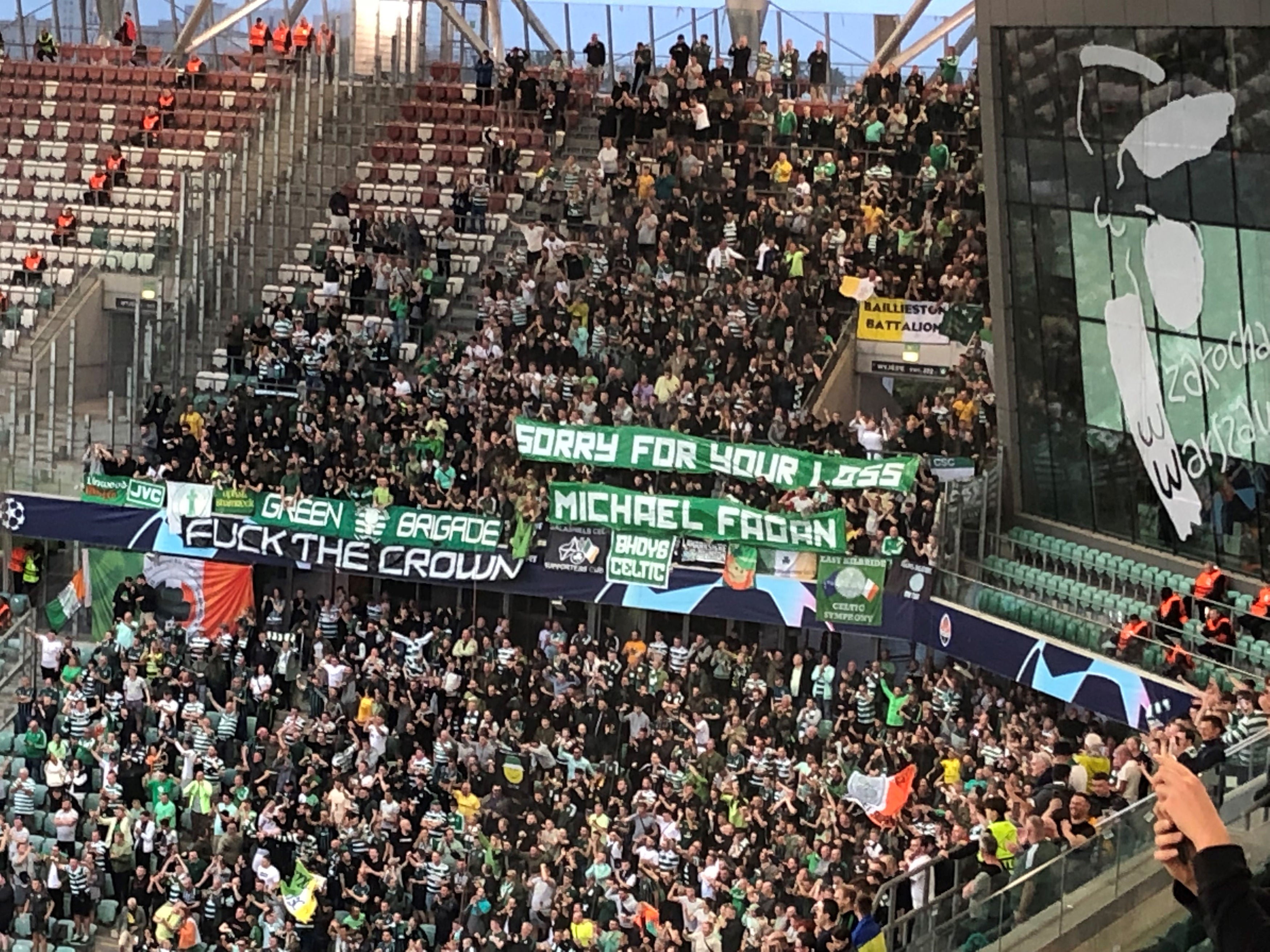 Celtic fans and banners in the stands at the Municipal Stadium of Legia Warsaw