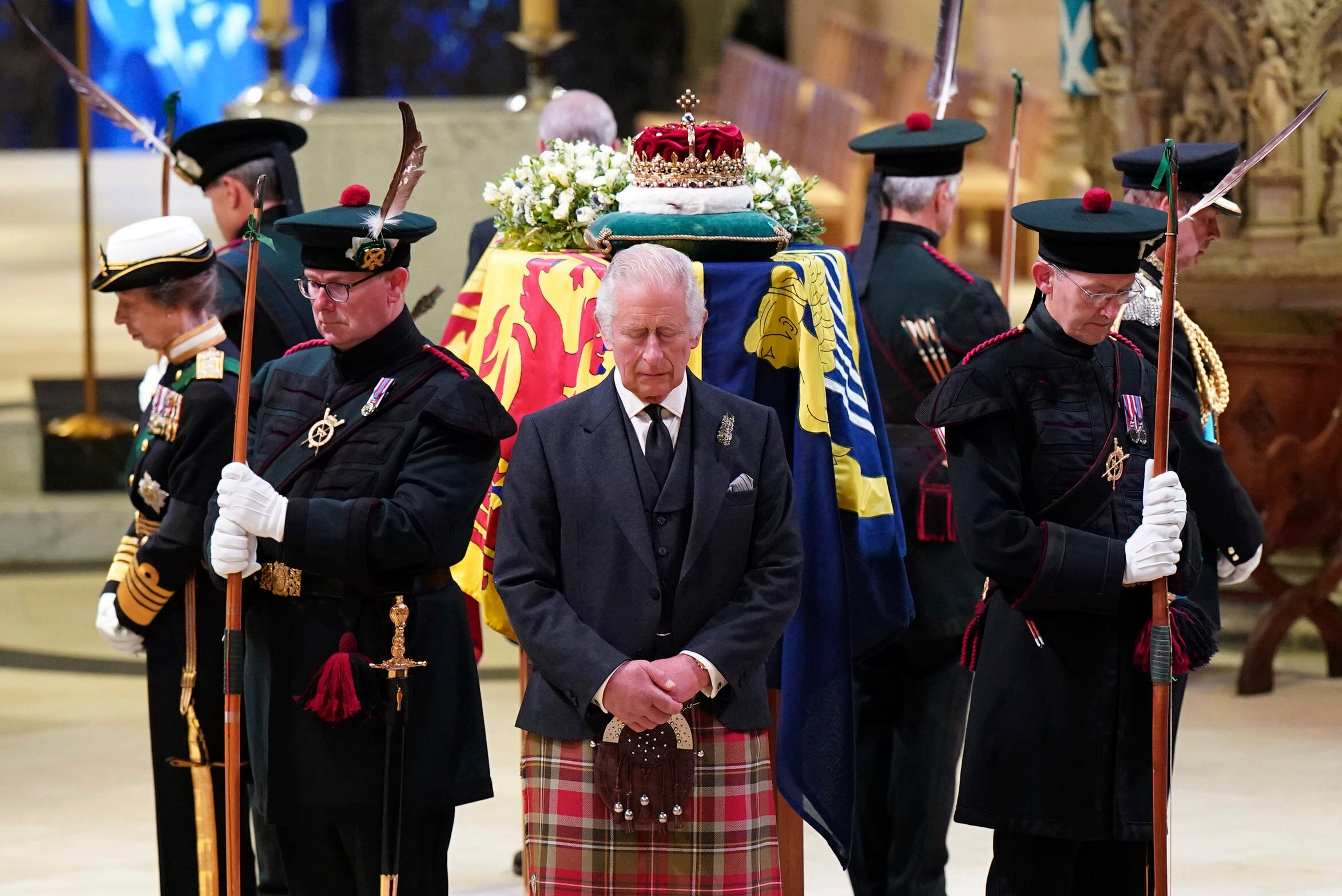 King Charles stood vigil over the Queen’s coffin on Monday in Edinburgh