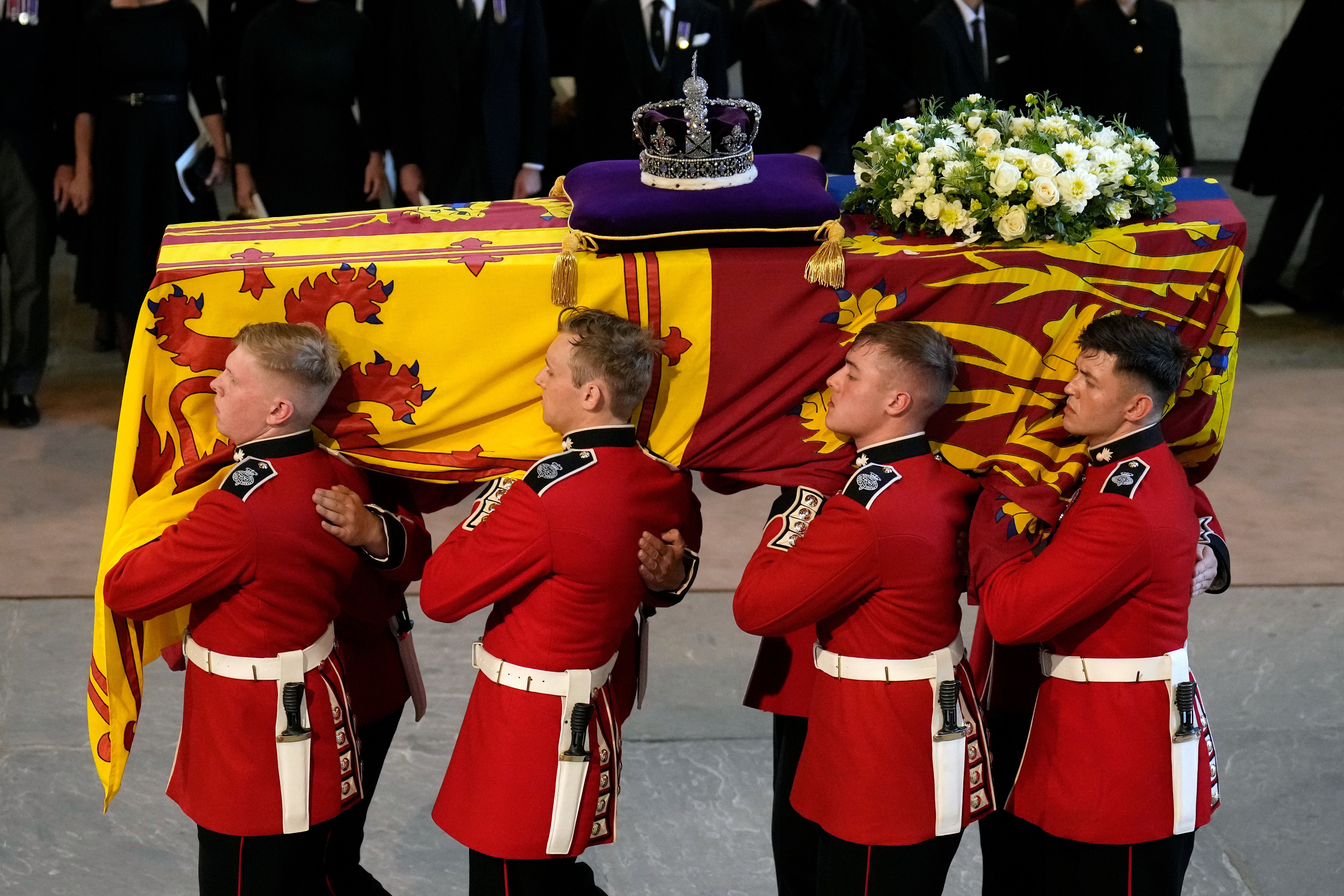 The bearer party carries the coffin of Queen Elizabeth II into Westminster Hall