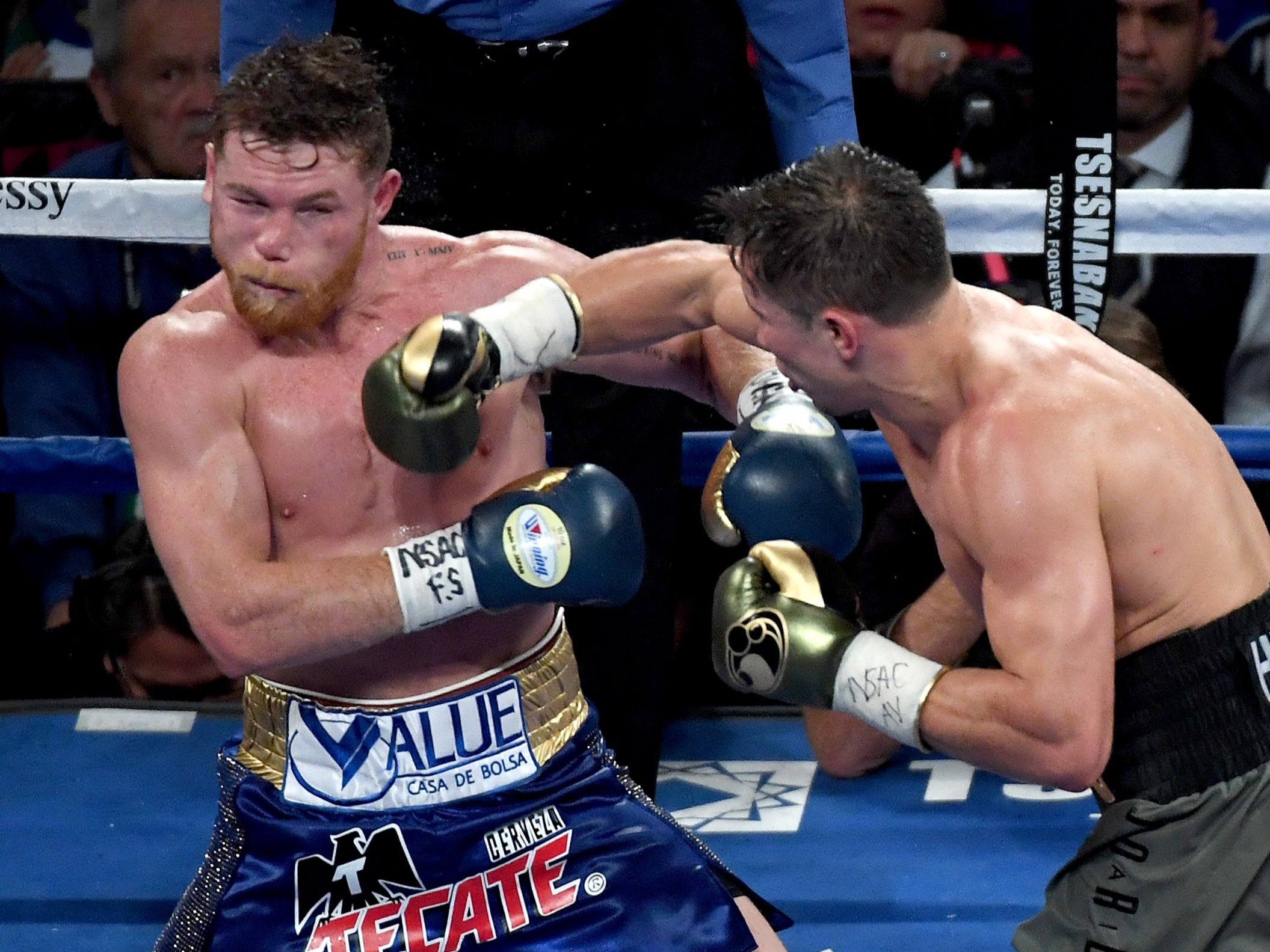 Golovkin (right) out-struck Canelo in their first fight, which ended as a draw