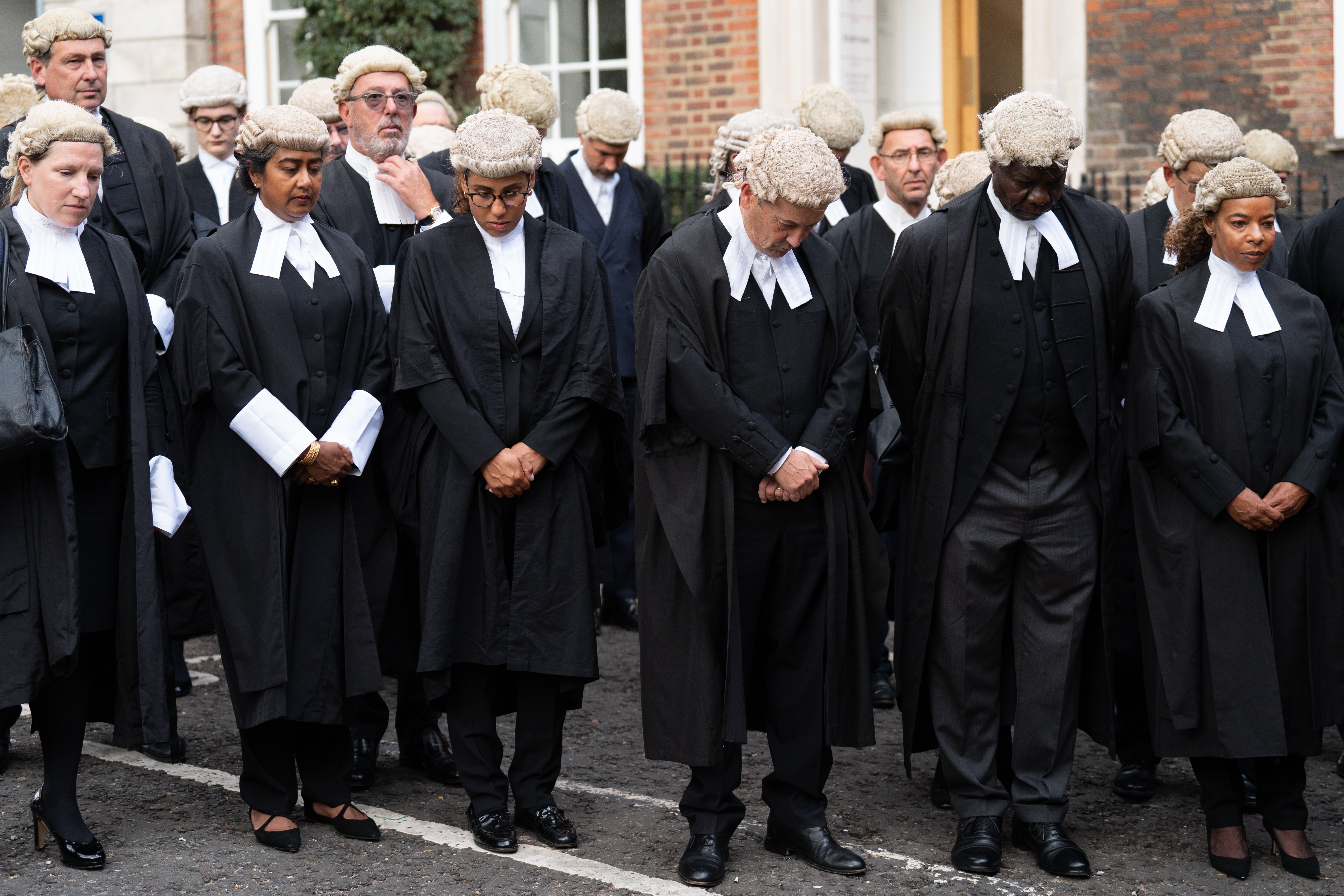 King’s Counsel take part in a wreath laying after the death of the Queen (Stefan Rousseau/PA)