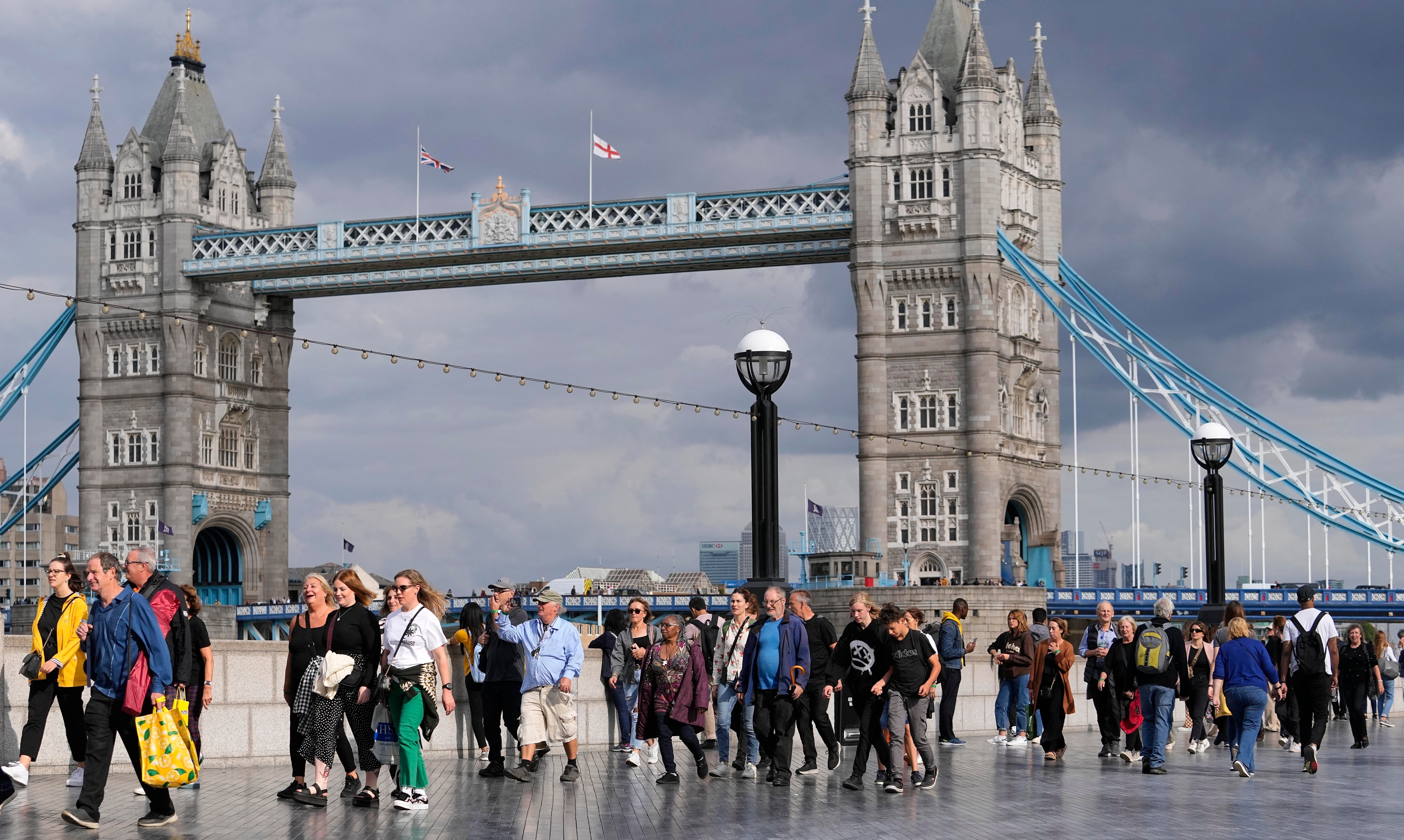 People queue in their thousands to pay their respects to the late Queen