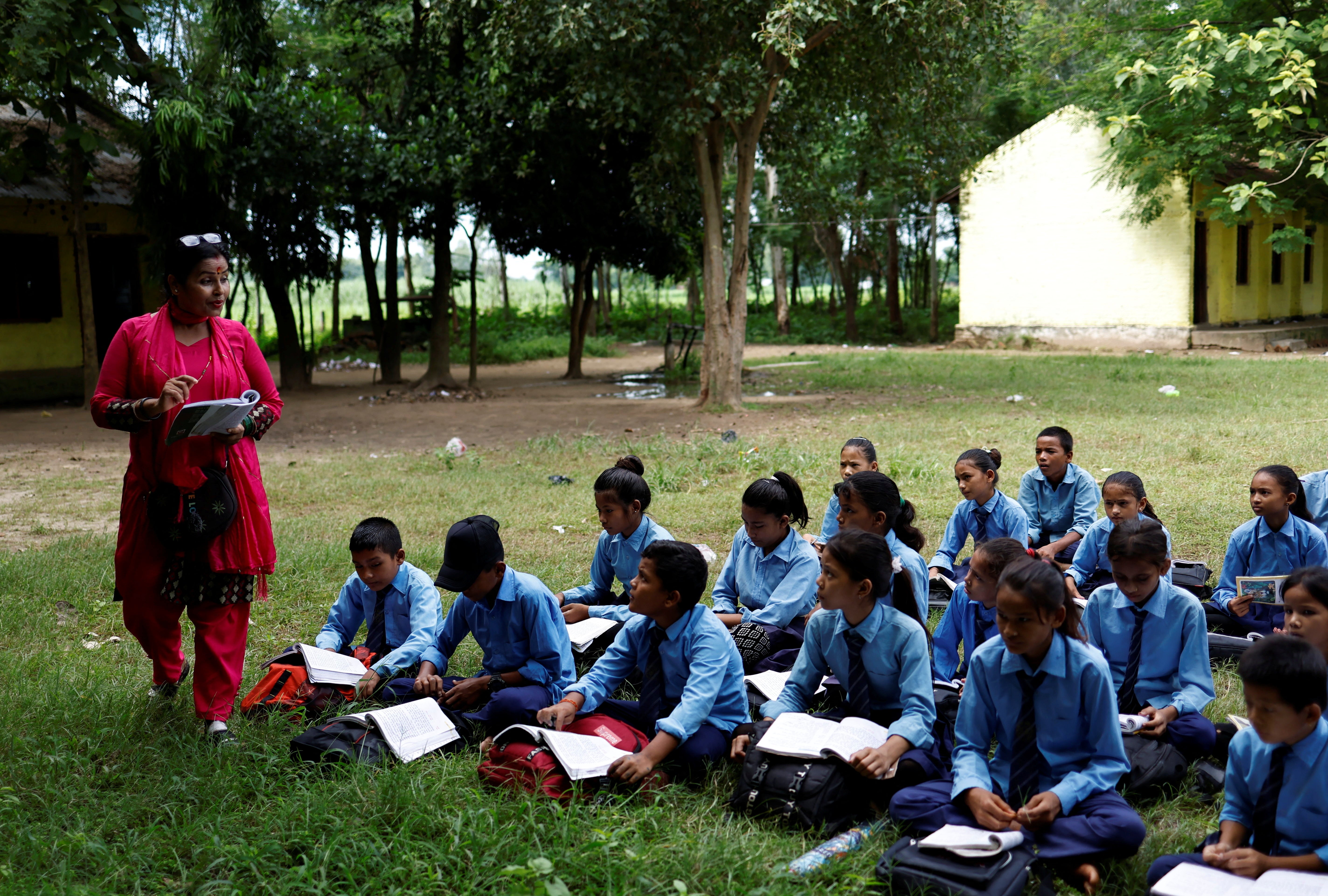 Resham’s lesson is taken outdoors because the fan in the classroom is broken