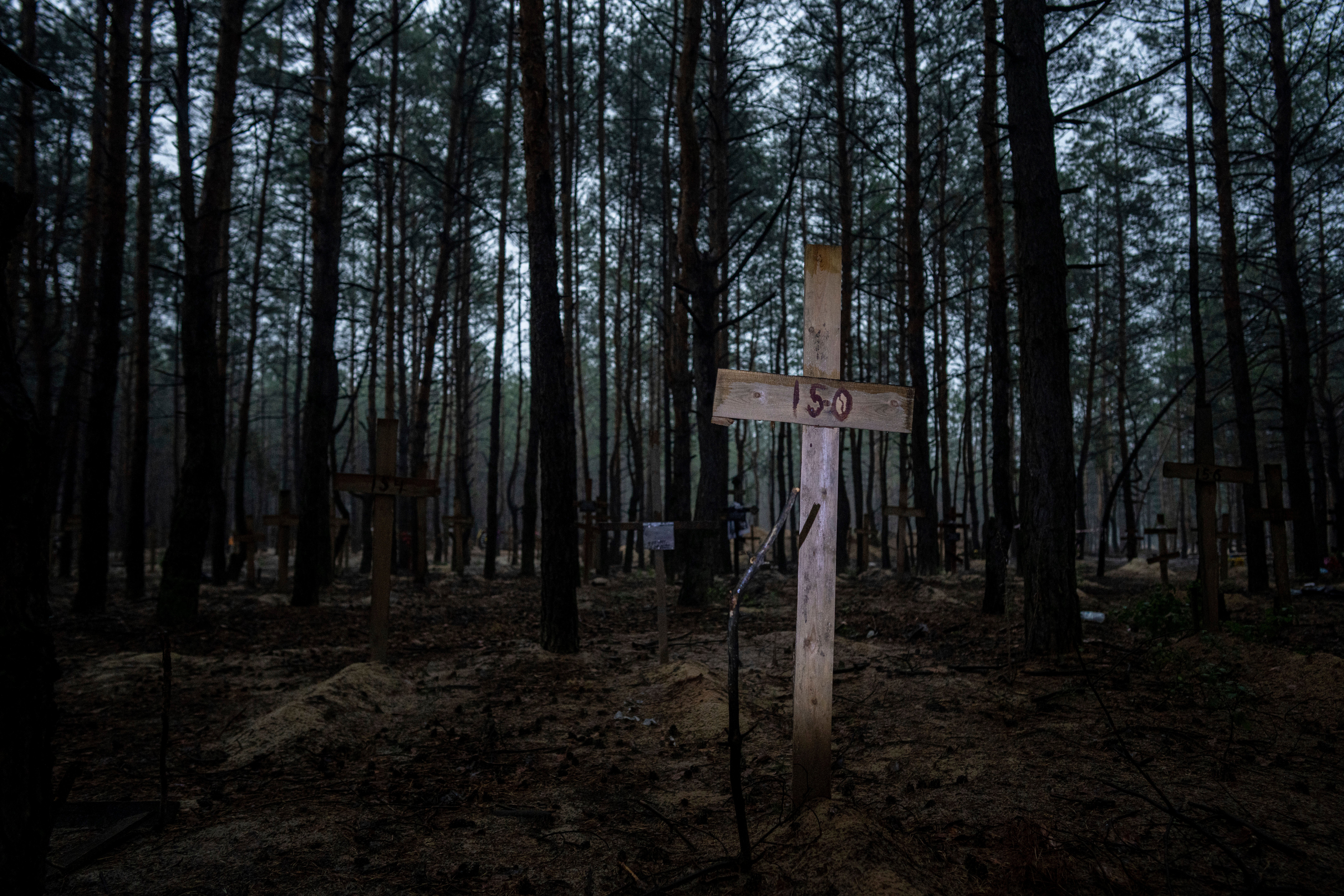 A view of unidentified graves of civilians and Ukrainian soldiers in a cemetery in the recently retaken area of Izyum