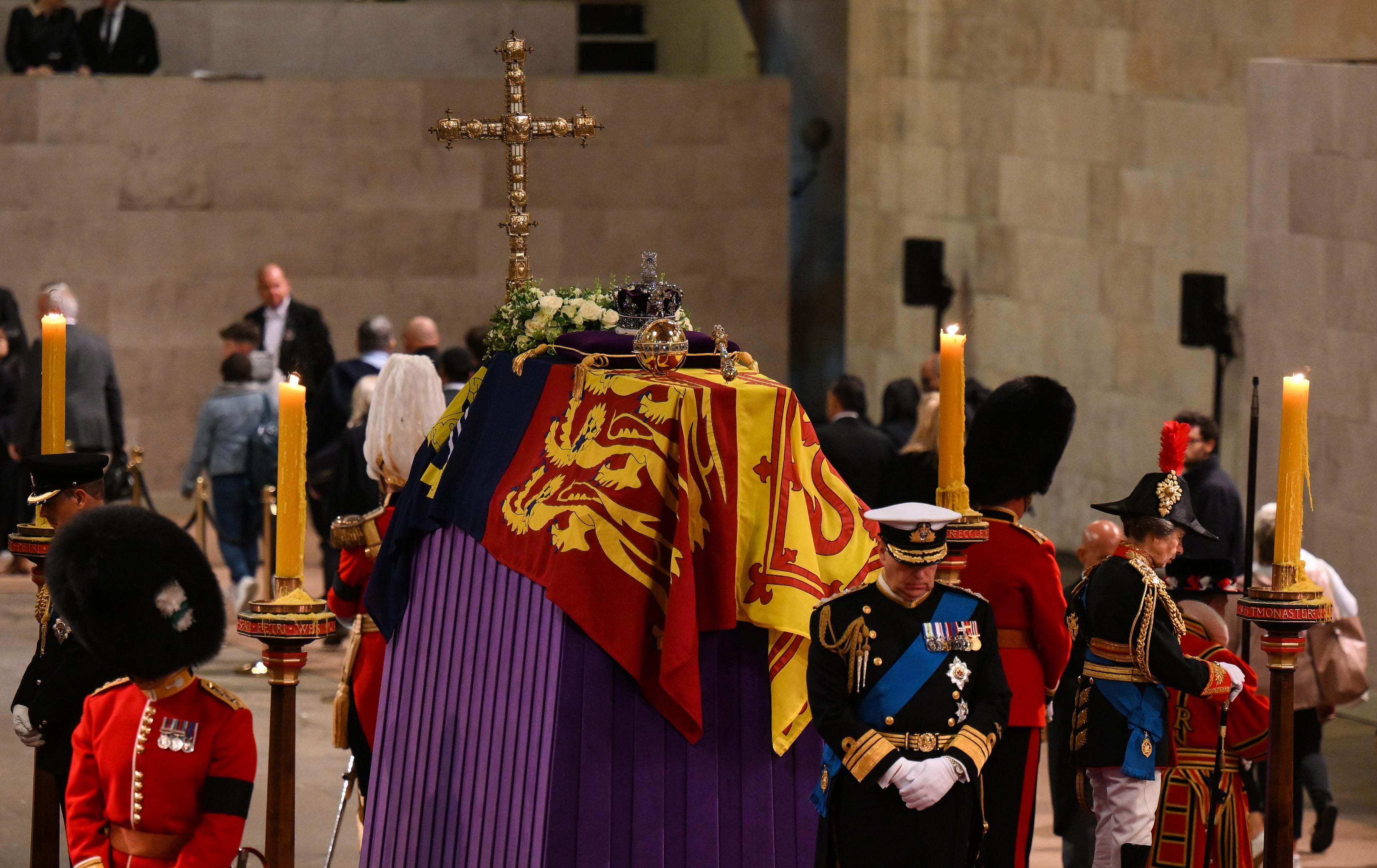 Princess Anne, Princess Royal and Prince Andrew, Duke of York take part in a vigil at the hall two and a half hours before the incident