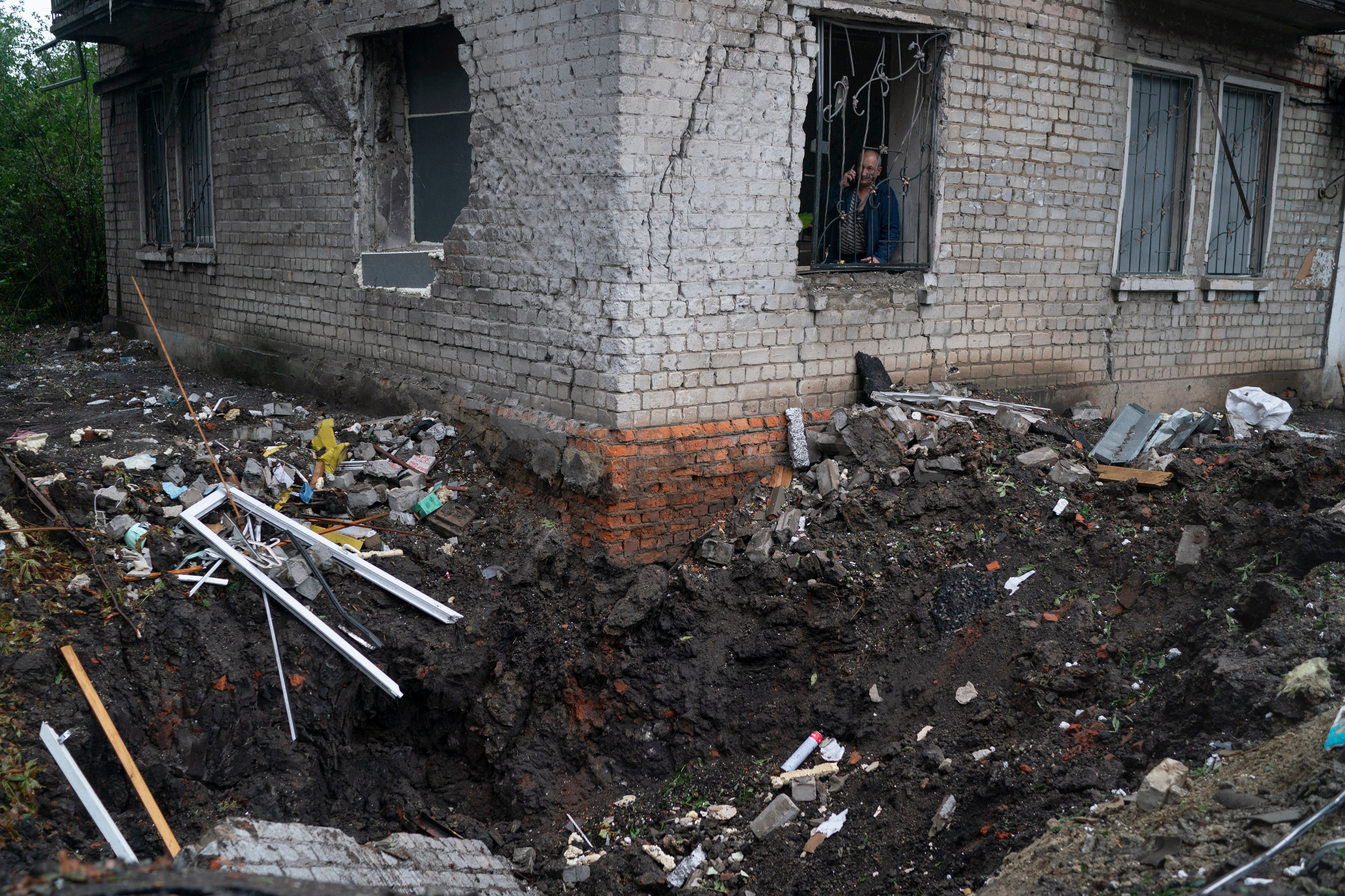 A crater created by an explosion during a Russian attack in a residential area in Kharkiv