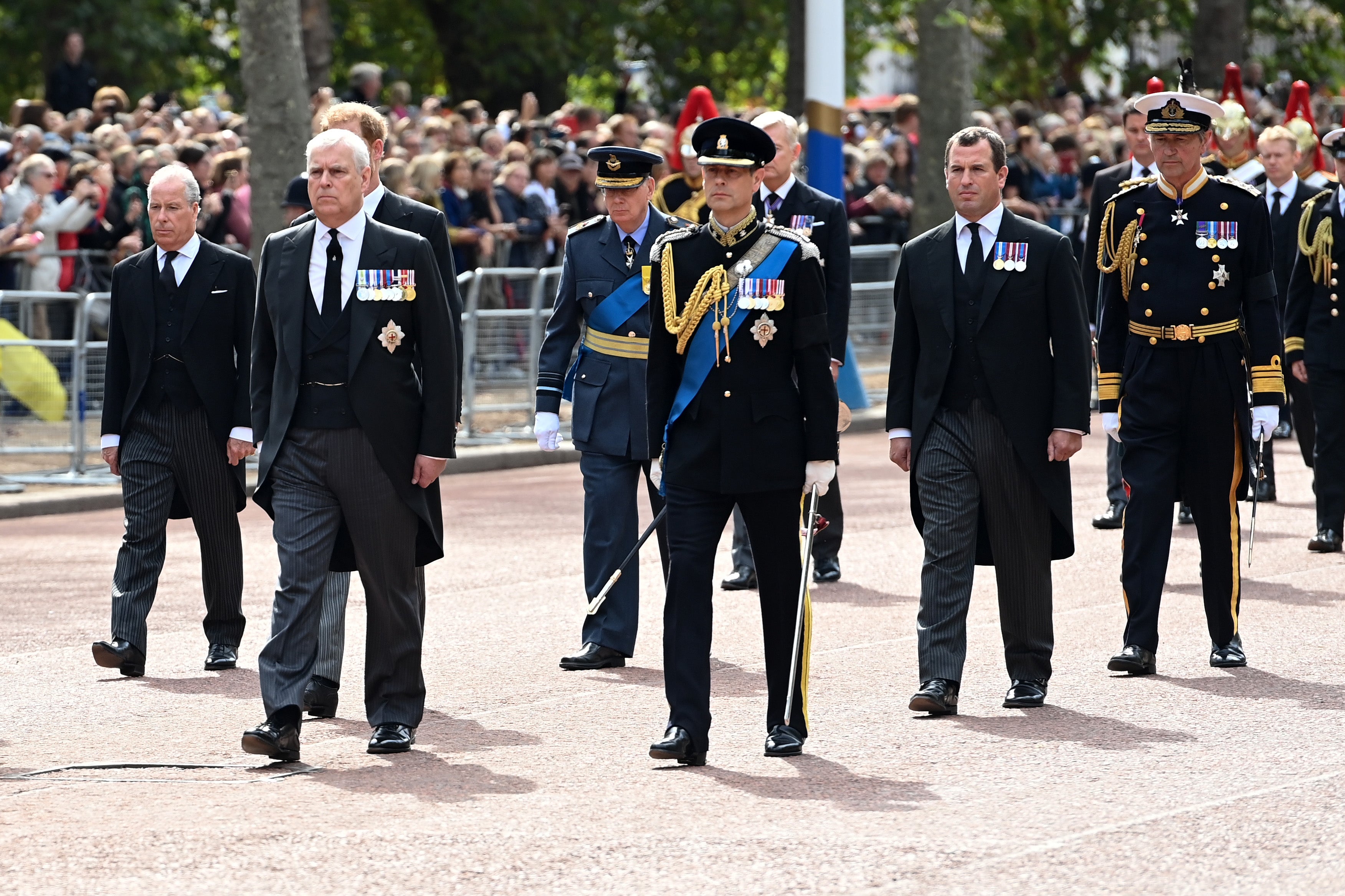 (L-R) David Armstrong-Jones, Earl of Snowdon, Prince Andrew, Duke of York, Prince Richard, Duke of Gloucester, Prince Edward, Earl of Wessex, Peter Phillips and Vice Admiral, Sir Timothy Laurence walk behind the coffin along The Mall during the procession for the Lying-in State of Queen Elizabeth II