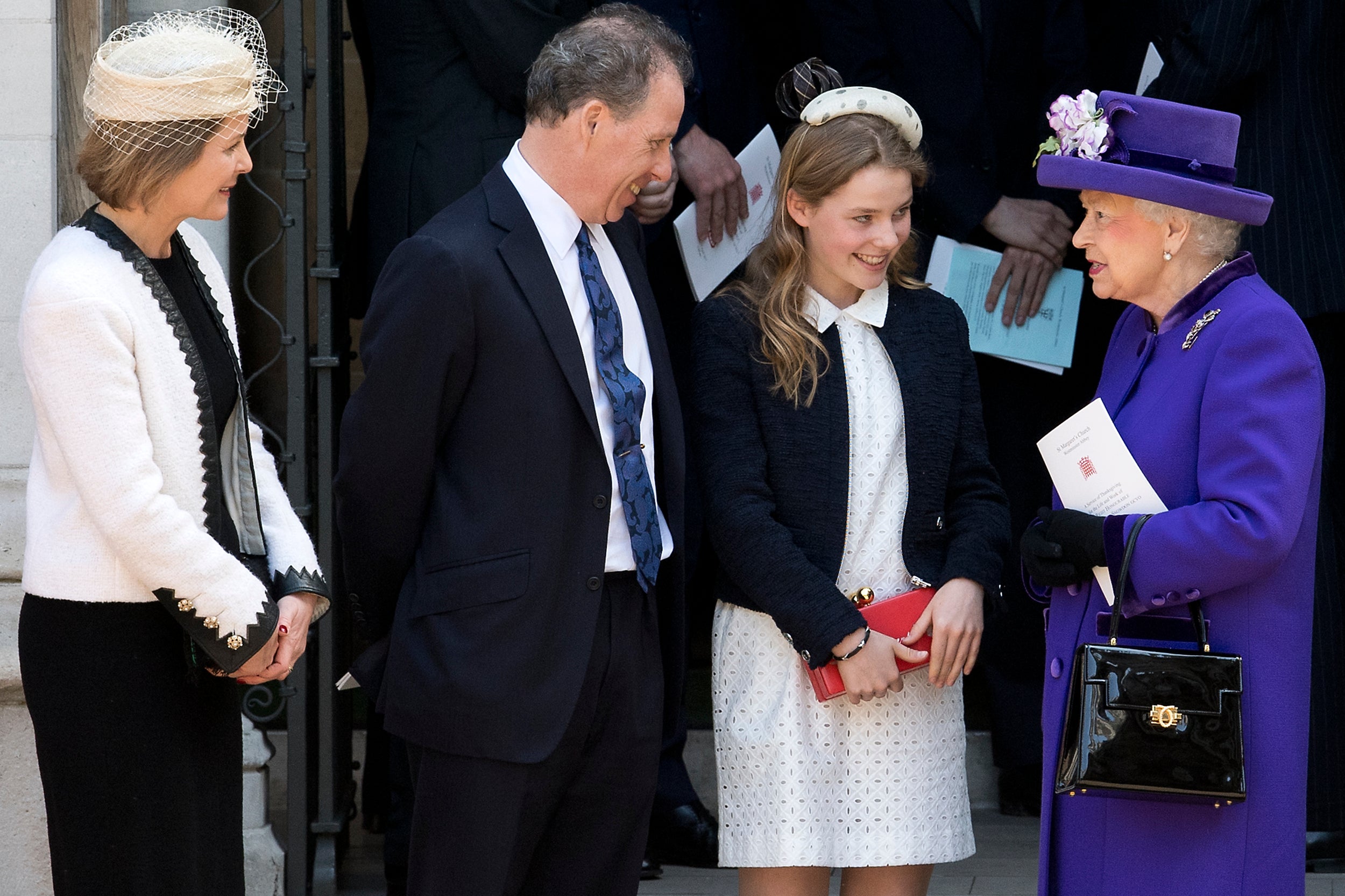 Queen Elizabeth II speaks to (L-R) Serena Armstrong-Jones, David Armstrong-Jones and Margarita Armstrong-Jones as they leave a Service of Thanksgiving for the life and work of Lord Snowdon at Westminster Abbey