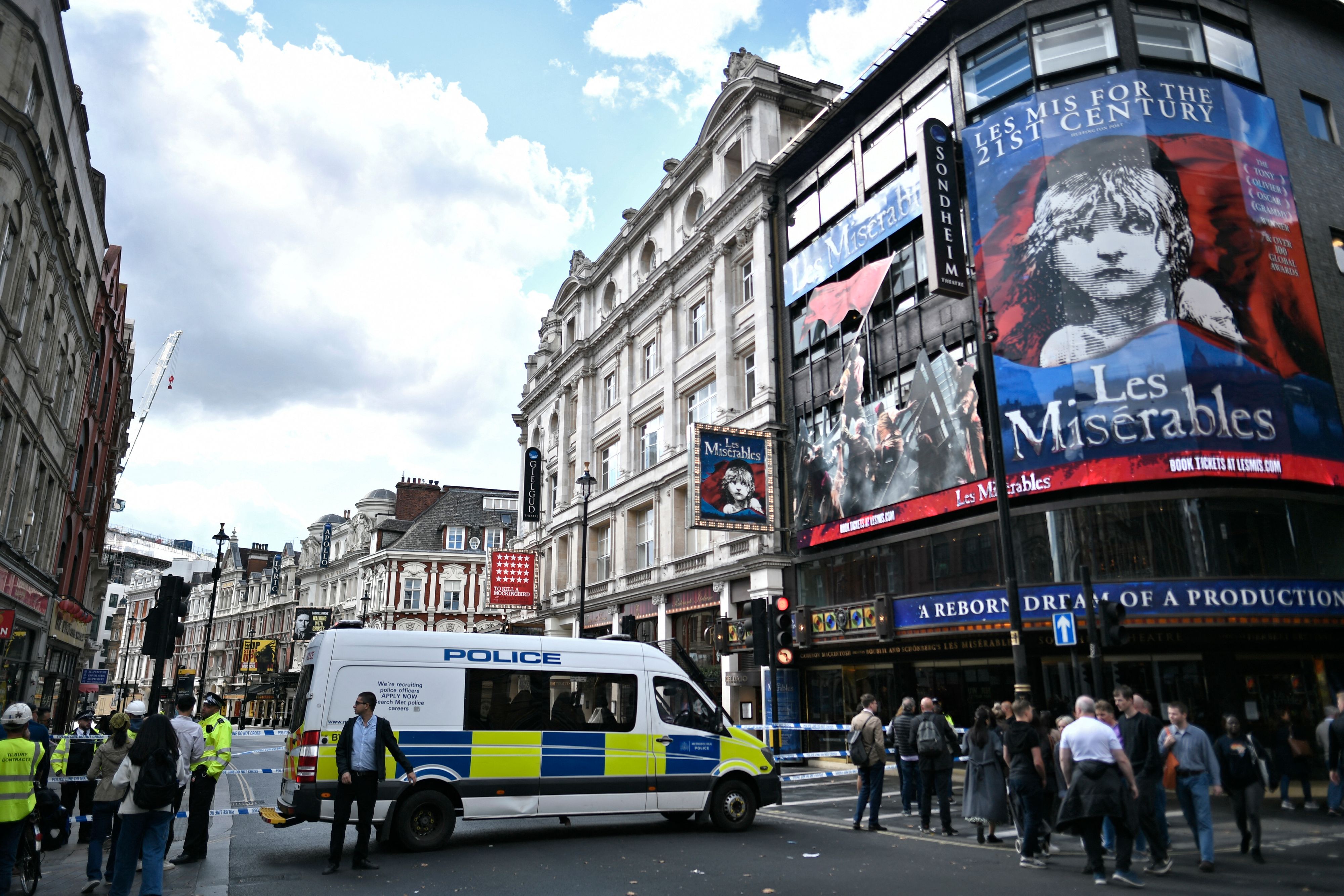 Police officers stand on duty by a cordon on Shaftesbury Avenue in central London following the stabbing of two police officers