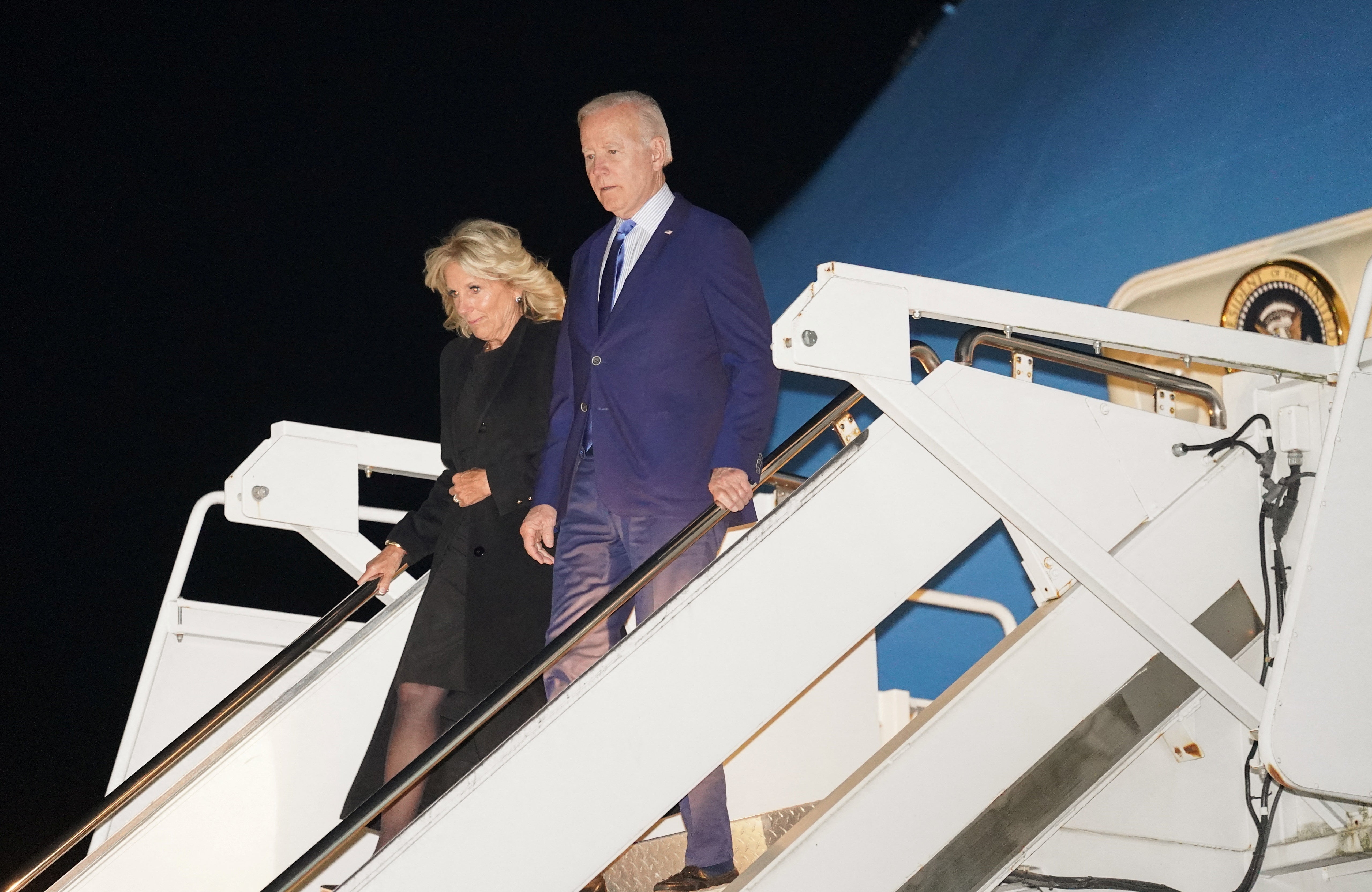 US President Joe Biden and first lady Jill Biden step from Air Force One upon arrival at Stansted Airport