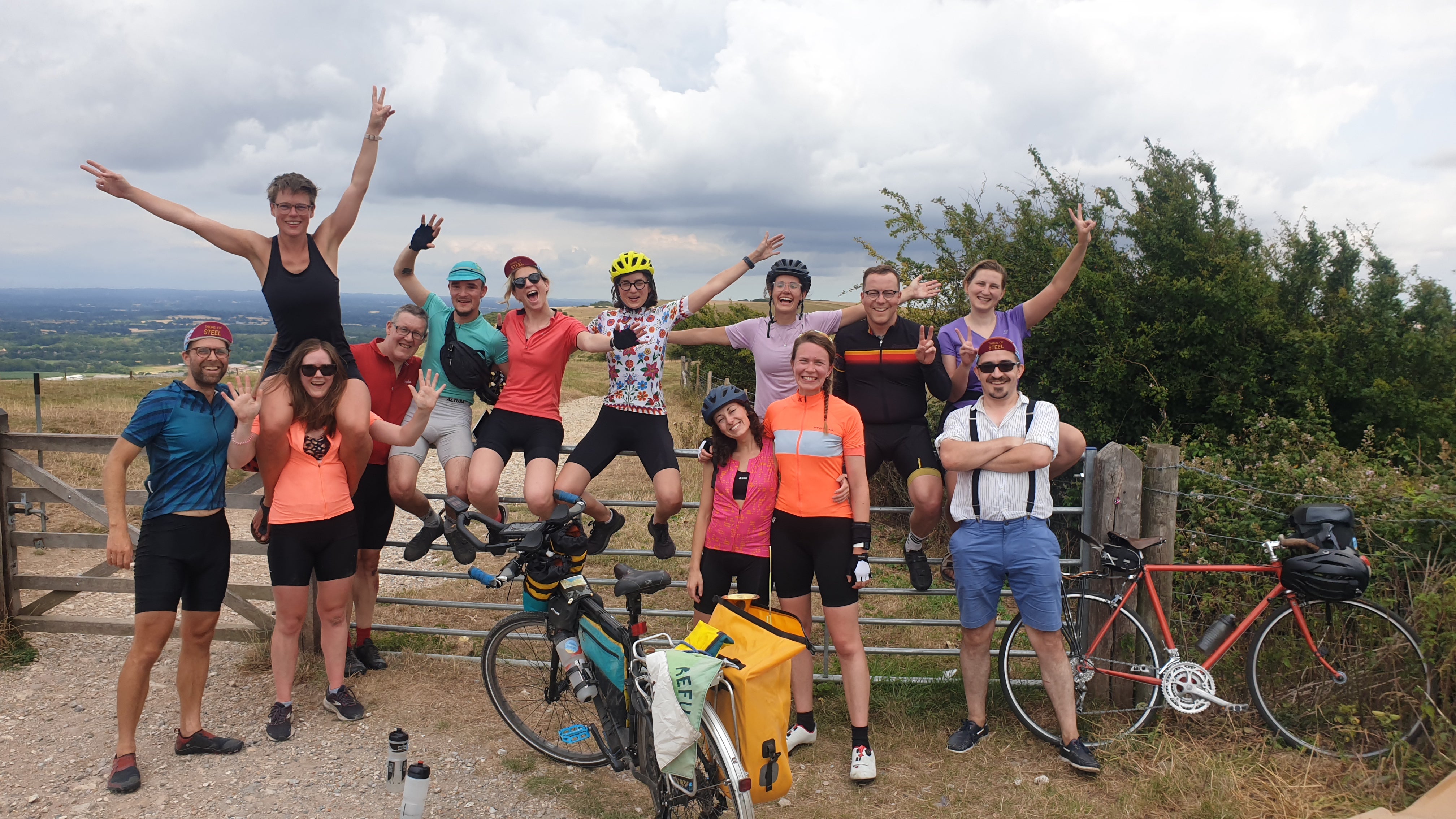 Thighs of Steel cyclists at the top of Ditchling Beacon (David Charles/PA)