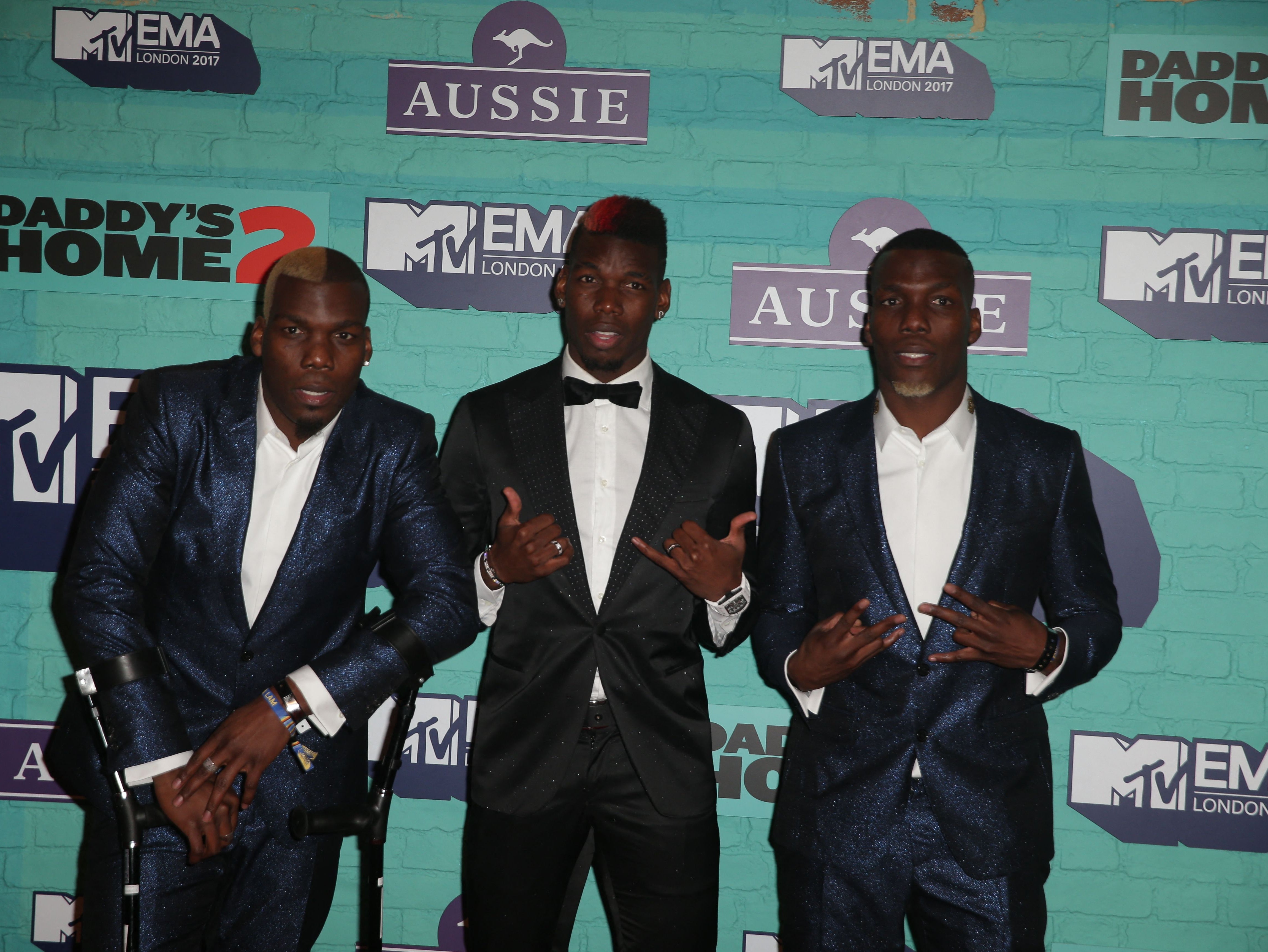 Juventus midfielder Paul Pogba (centre) with his brothers Florentin Pogba (left) and Mathias Pogba (right)