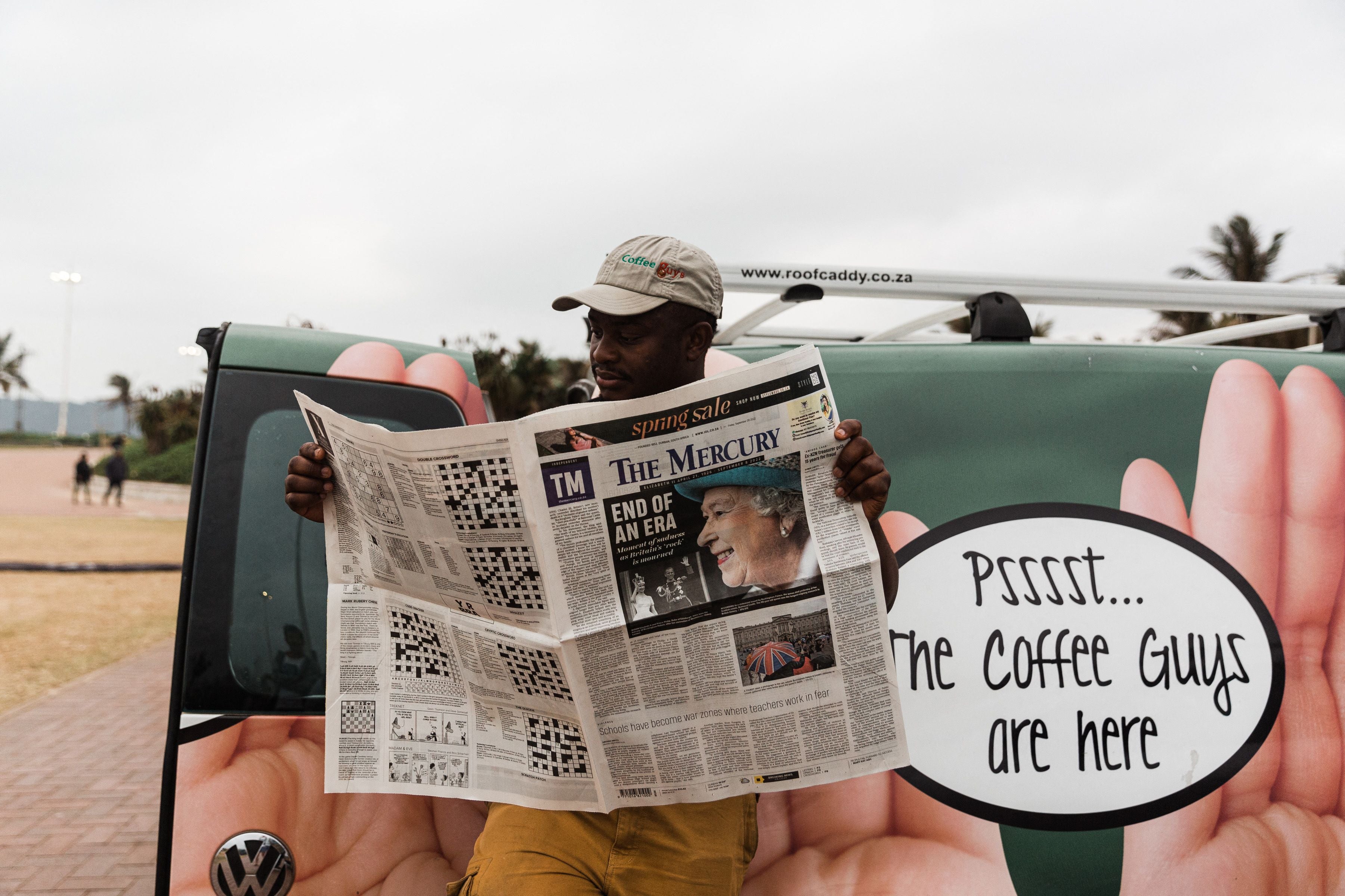 A man catches up on the latest news about the Queen’s passing in Durban