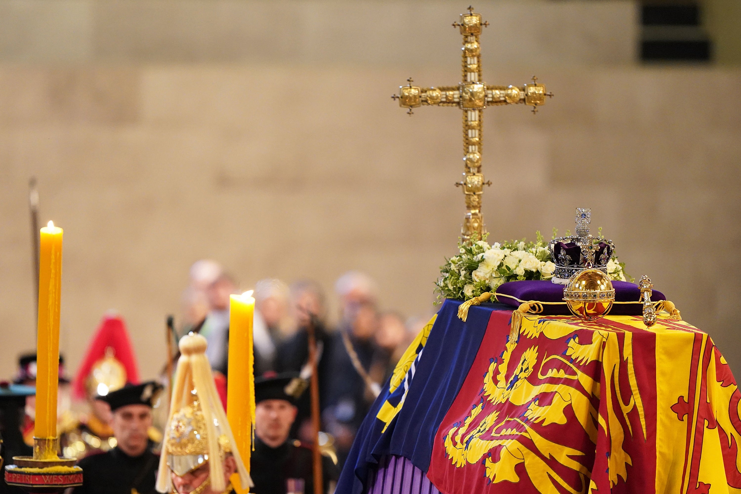 The coffin of Queen Elizabeth II, draped in the Royal Standard with the Imperial State Crown and the Sovereign's orb and sceptre is seen during the lying in state at Westminster Hall