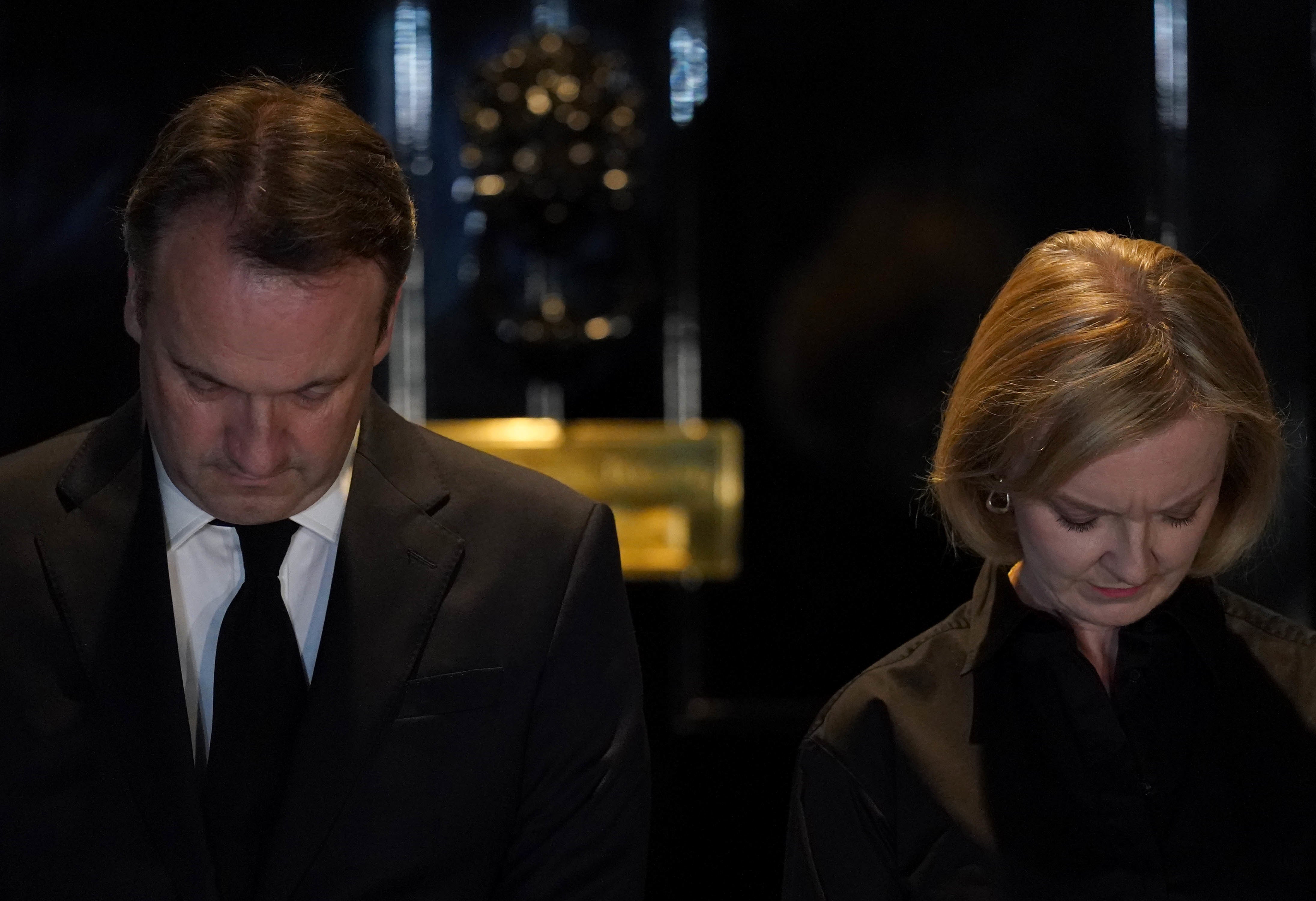 Prime Minister Liz Truss and her husband Hugh O’Leary observe the national minute’s silence