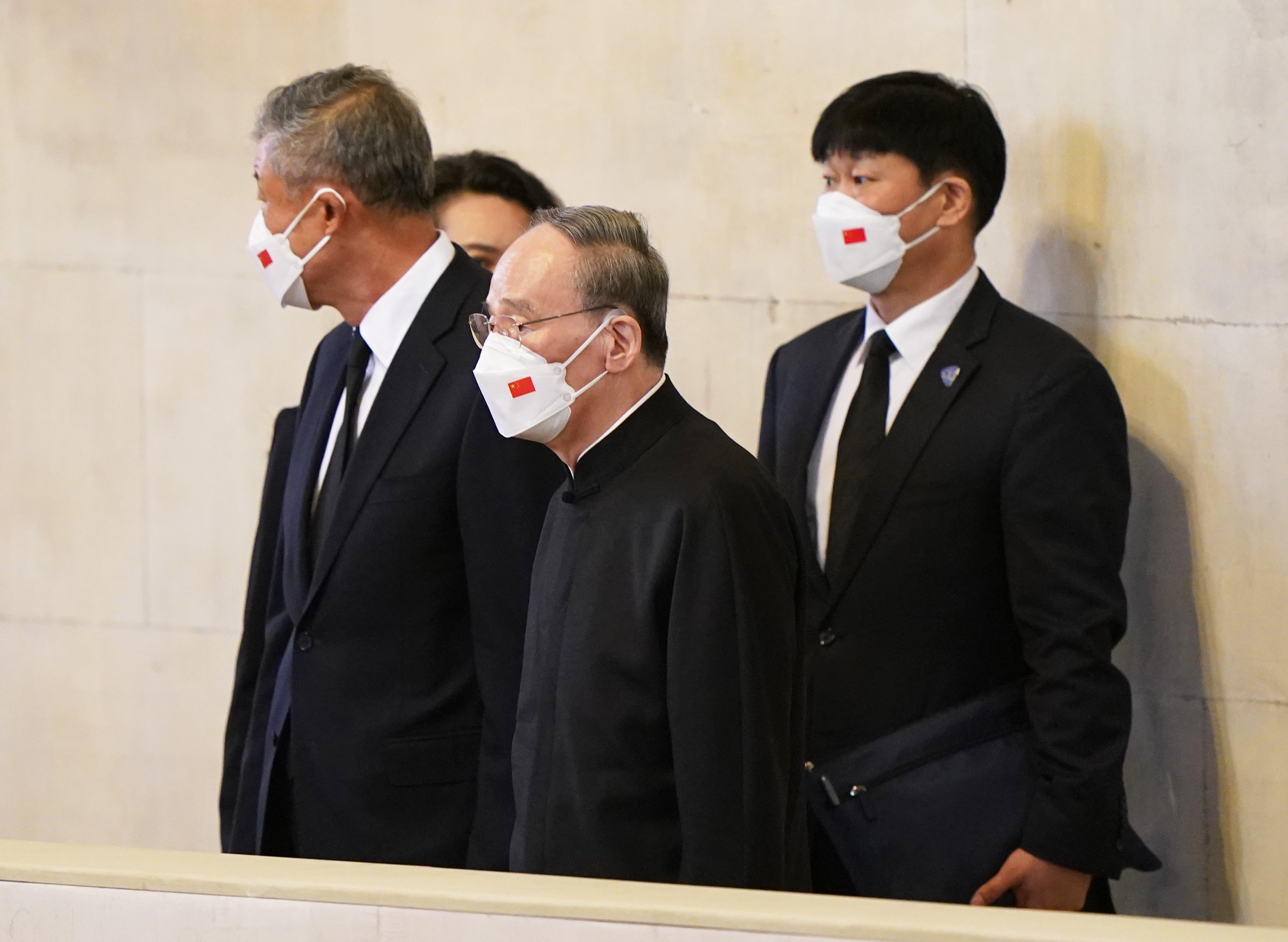 The Chinese delegation view the coffin of the Queen