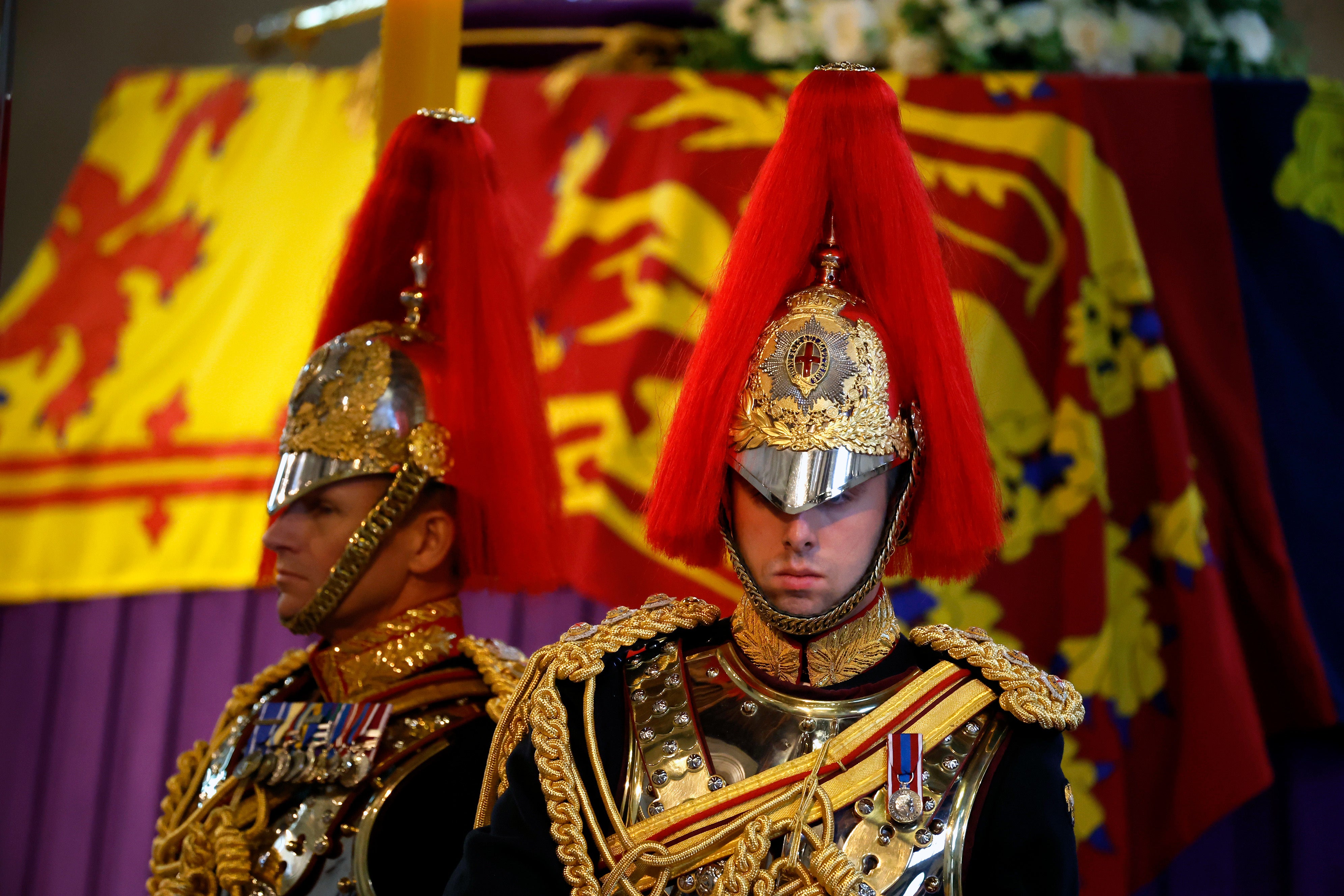 The Royal Guards stand as members of the public view the Queen’s coffin lying in state in Westminster Hall (Chip Somodevilla/PA)