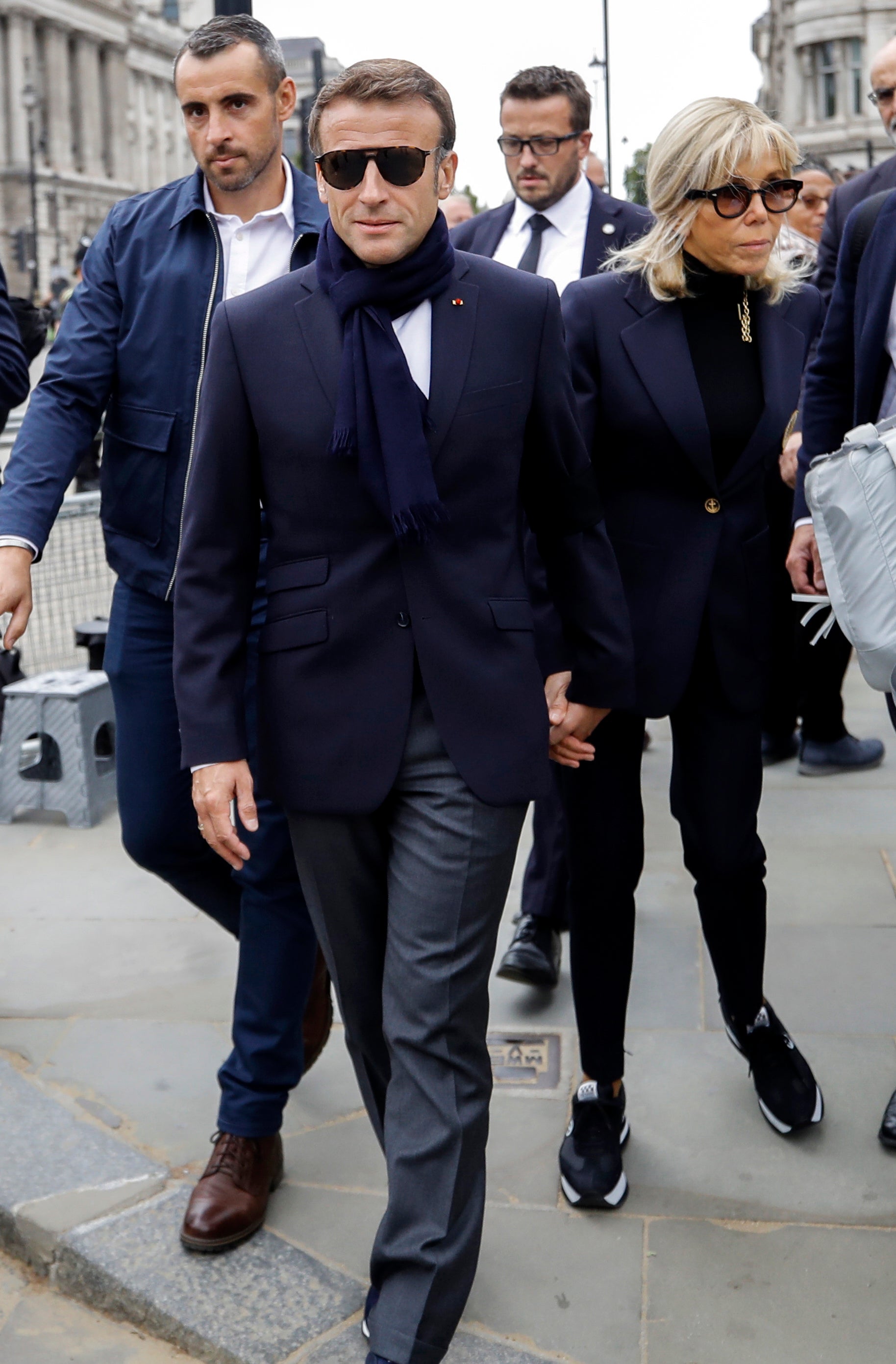 French President Emmanuel Macron and his wife Brigitte Macron (right) arrive at Westminster Hall to pay their respects to Britain’s late Queen Elizabeth II in London