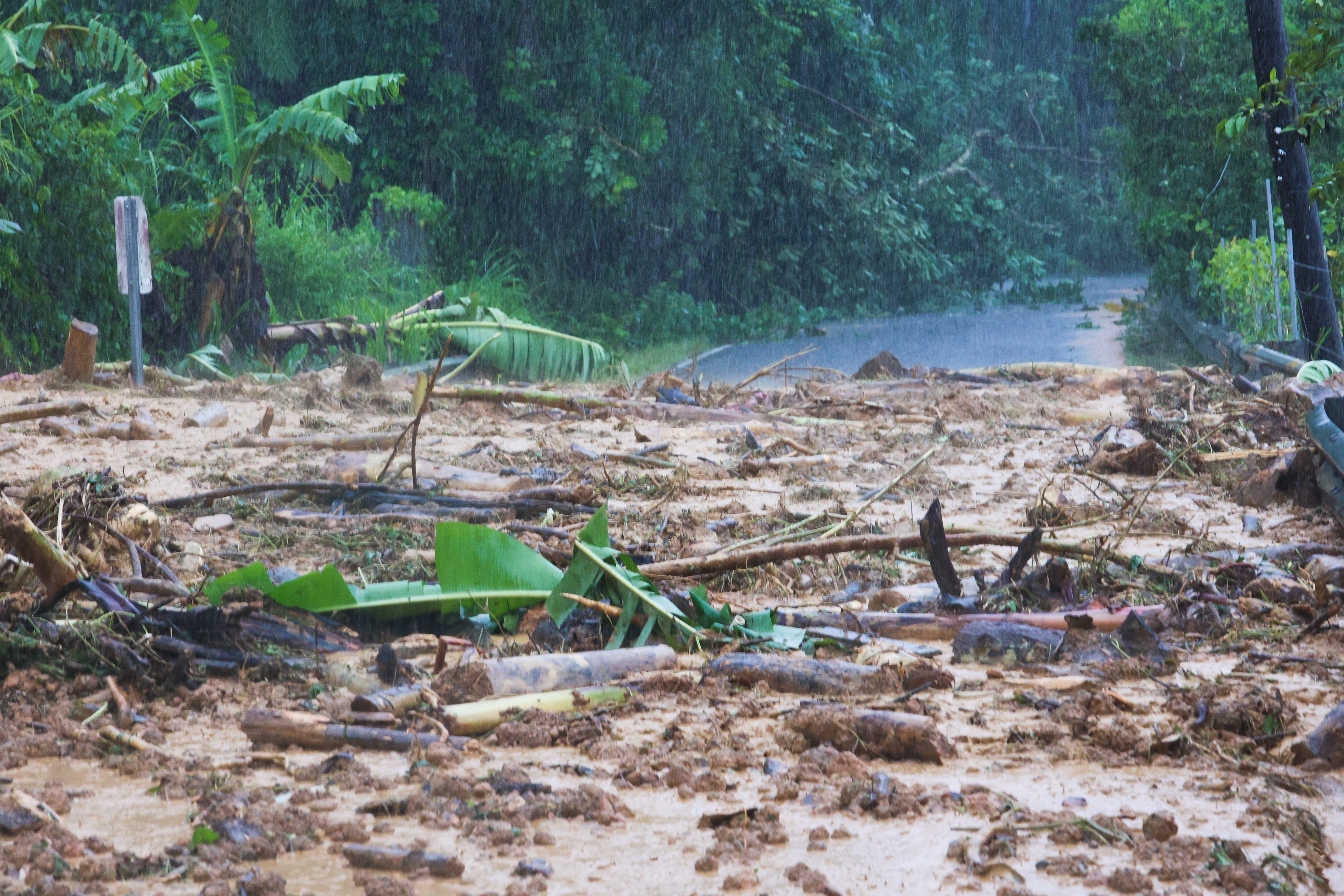 A road is blocked by a mudslide caused by Hurricane Fiona in Cayey, Puerto Rico, Sunday, 18 September 2022