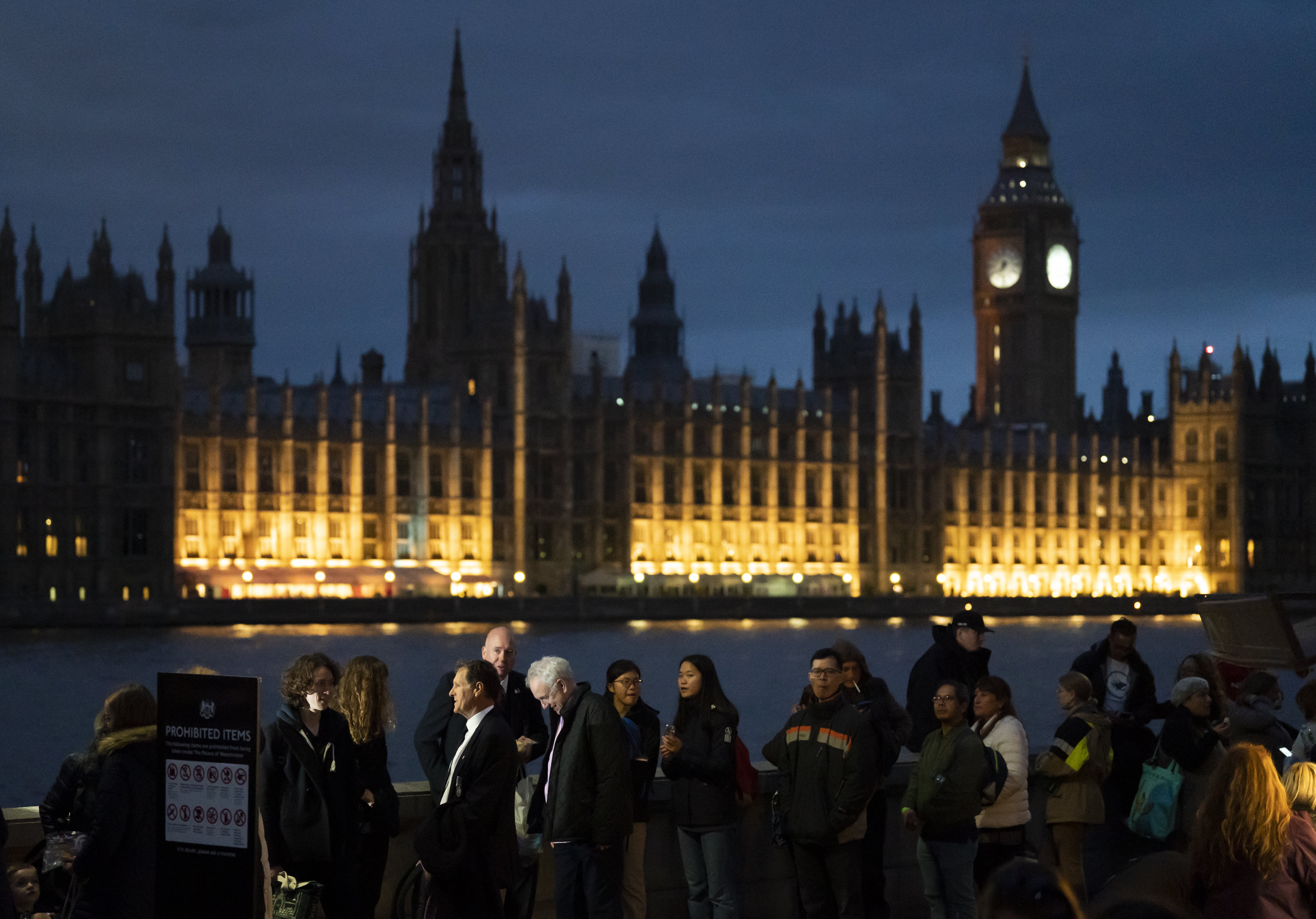 Members of the public queue on the South Bank in London, as they wait to view the Queen lying in state ahead of her funeral on Monday (Danny Lawson/PA)