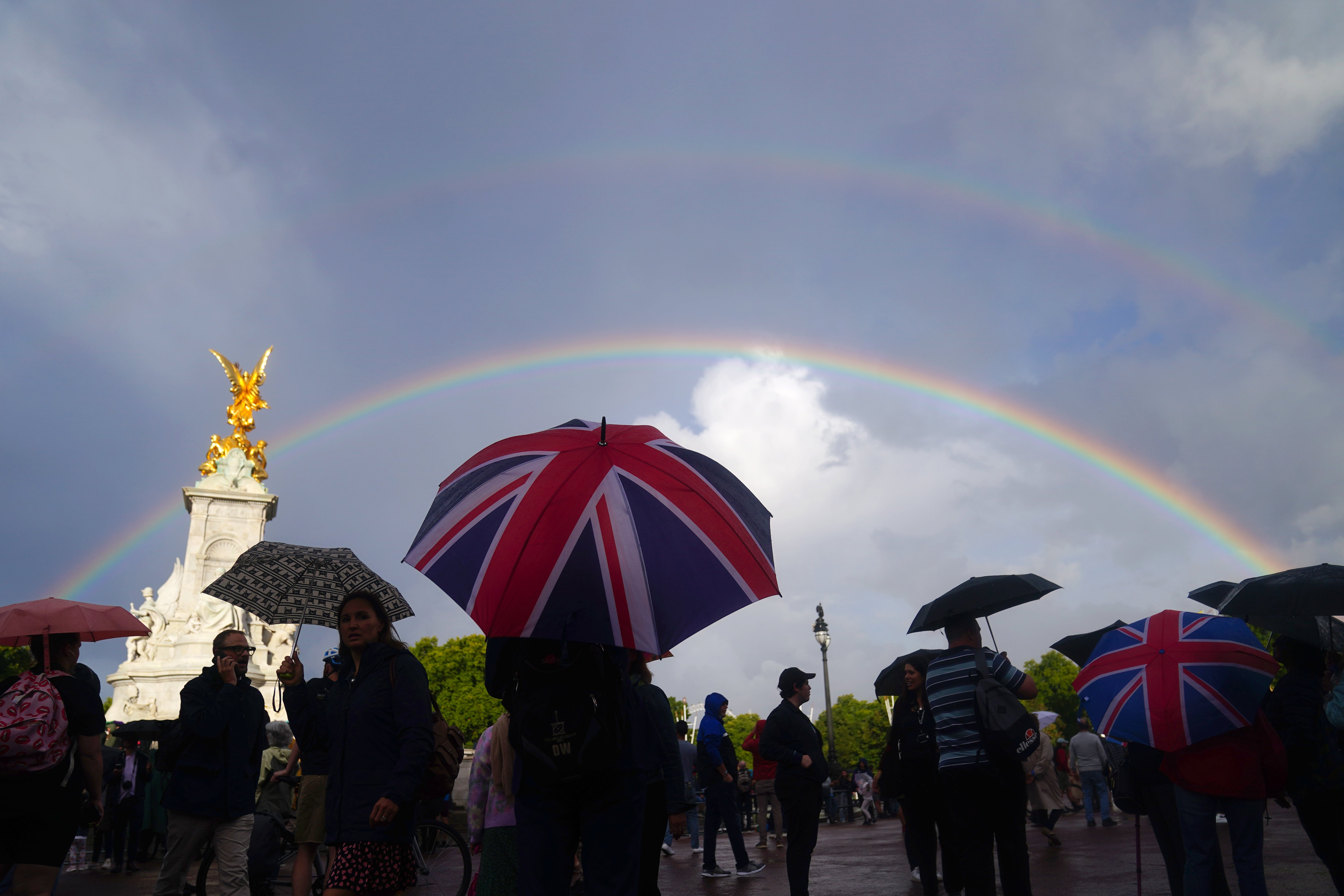 A rainbow was seen as members of the public gathered outside Buckingham Palace in central London, hours before Queen Elizabeth II’s death was announced