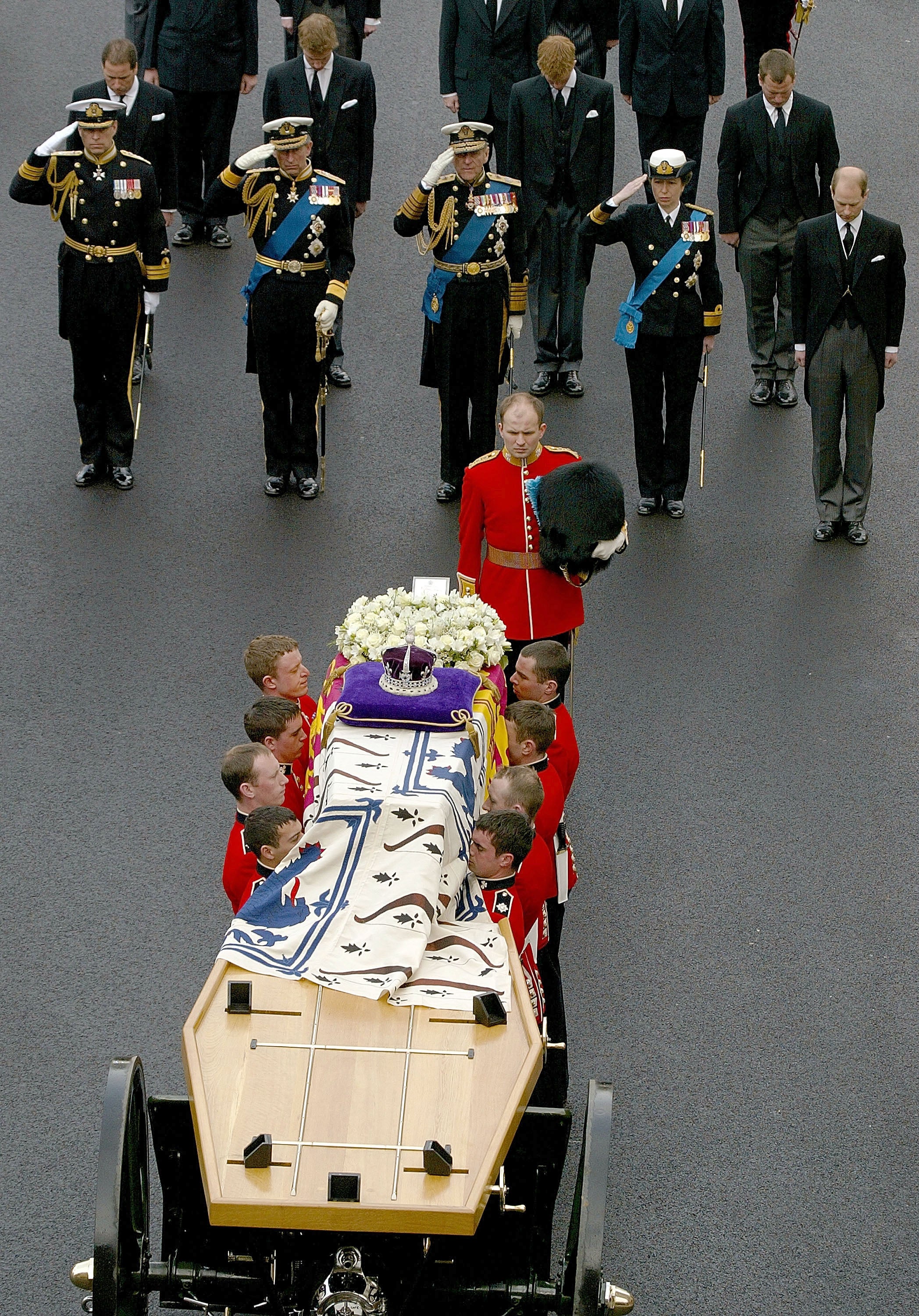 Pallbearers convey the coffin into the Abbey