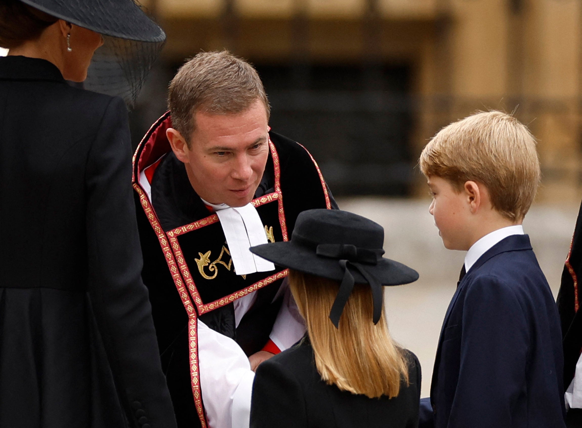 Princess Charlotte and Prince George were greeted by The Reverend Jamie Hawkey outside Westminster Abbey