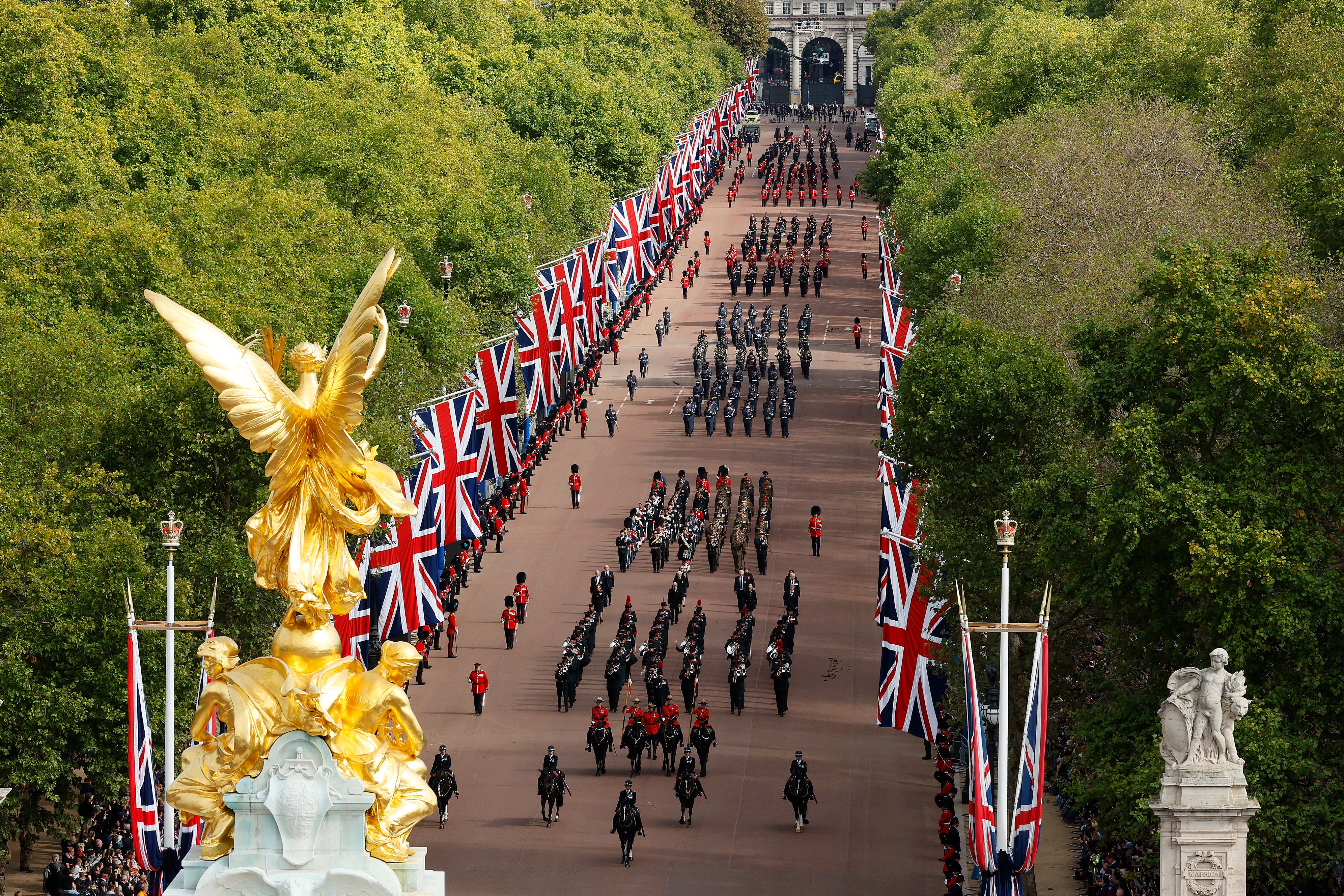 The funeral procession marches down The Mall