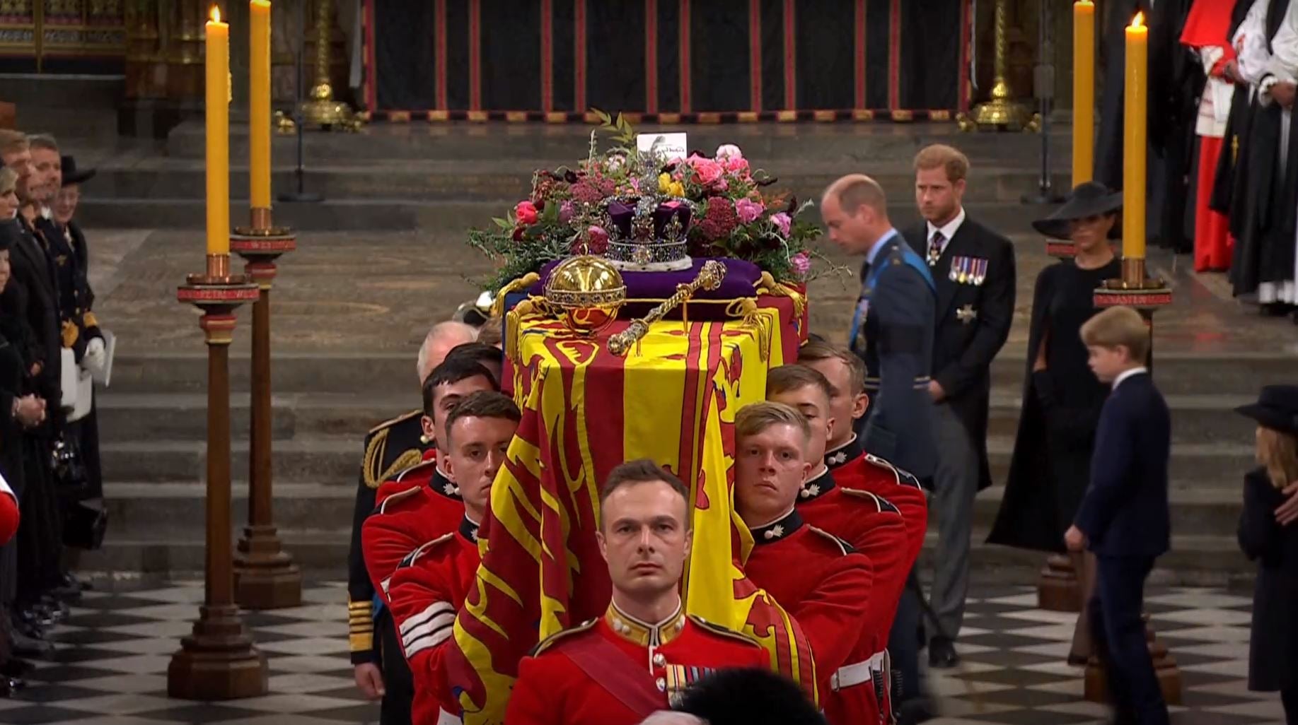 The Queen’s coffin being carried in Westminster Abbey