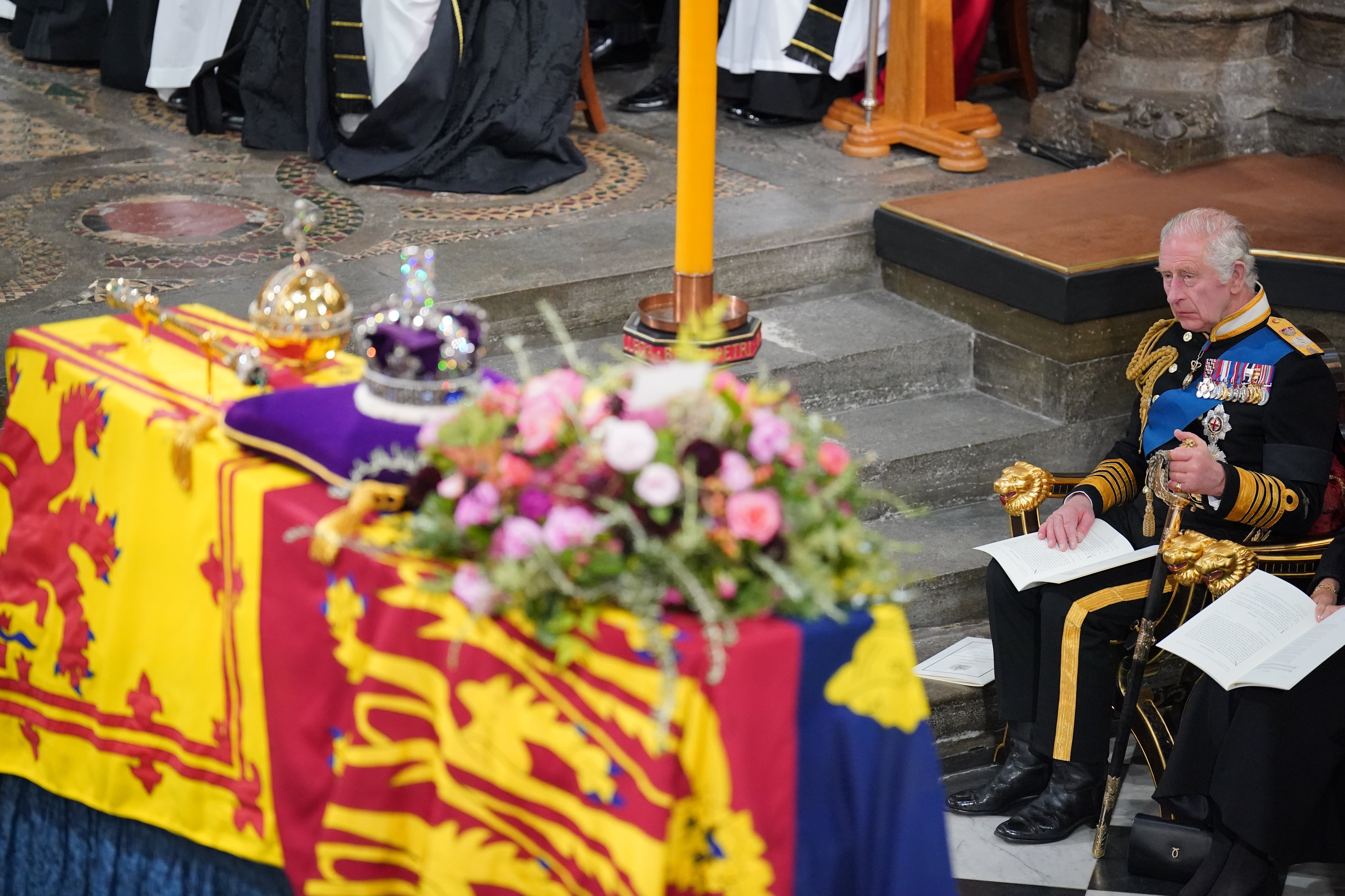 King Charles III rubbing his thumb on his sword is potentially a sign of self soothing (Dominic Lipinski/PA)