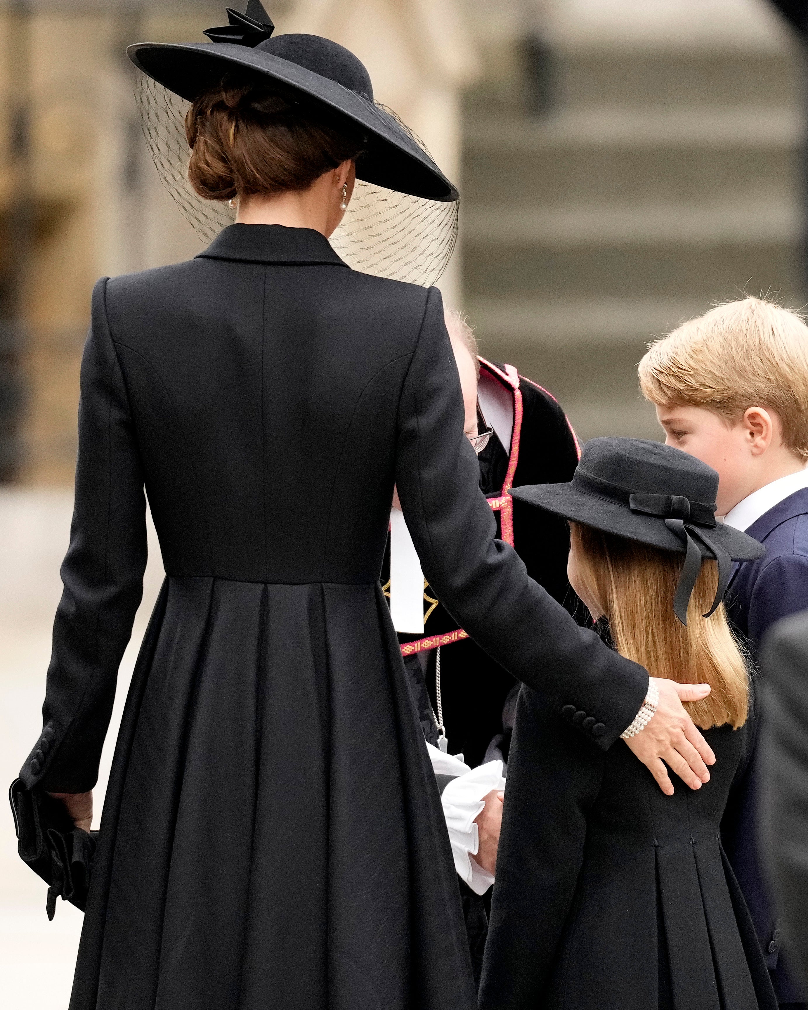 Princess of Wales offers comforting hand to the young prince and princess