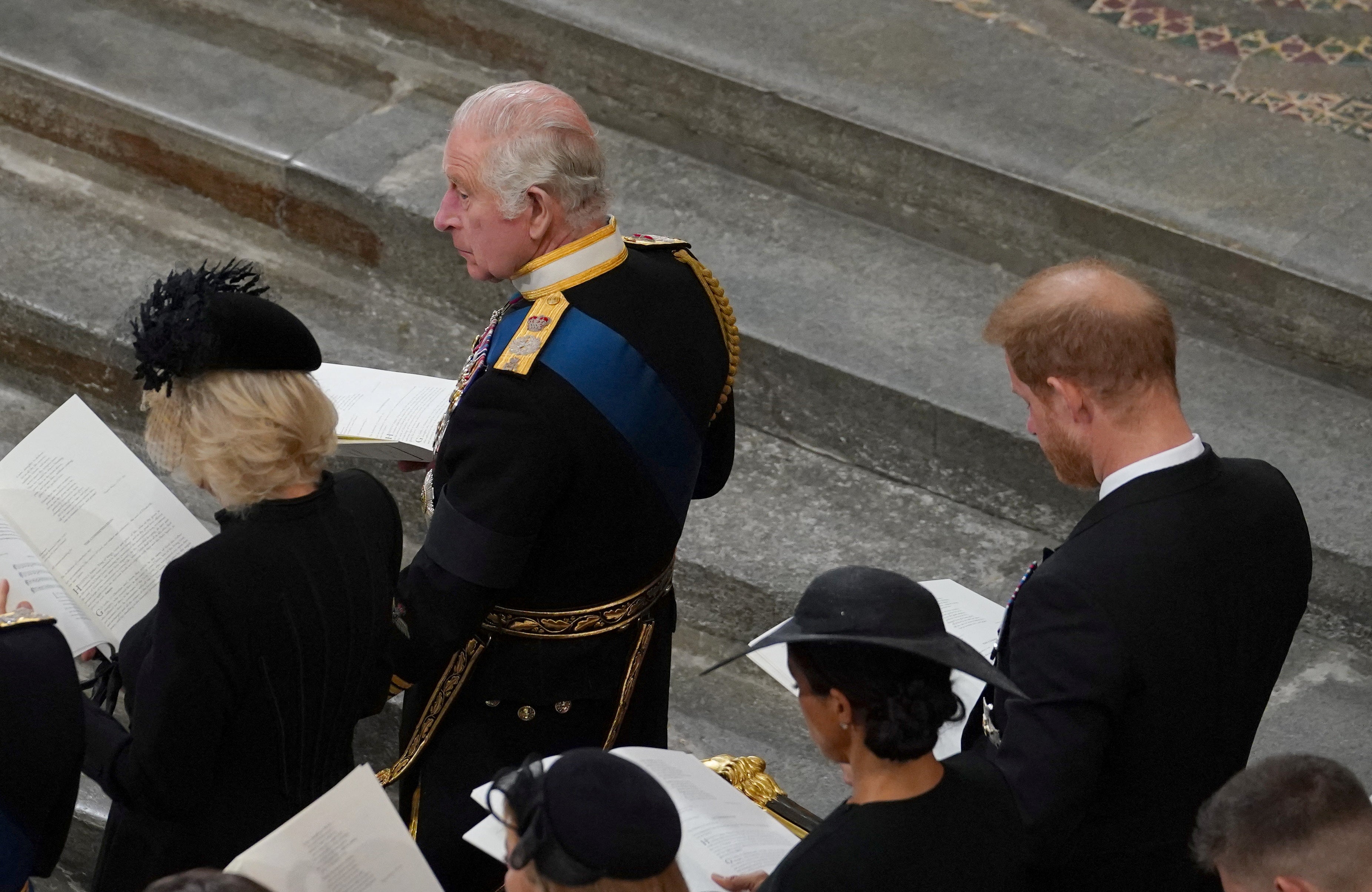 King Charles III, the Queen Consort in front of the Duke and Duchess of Sussex during the State Funeral of Queen Elizabeth II, held at Westminster Abbey, London.