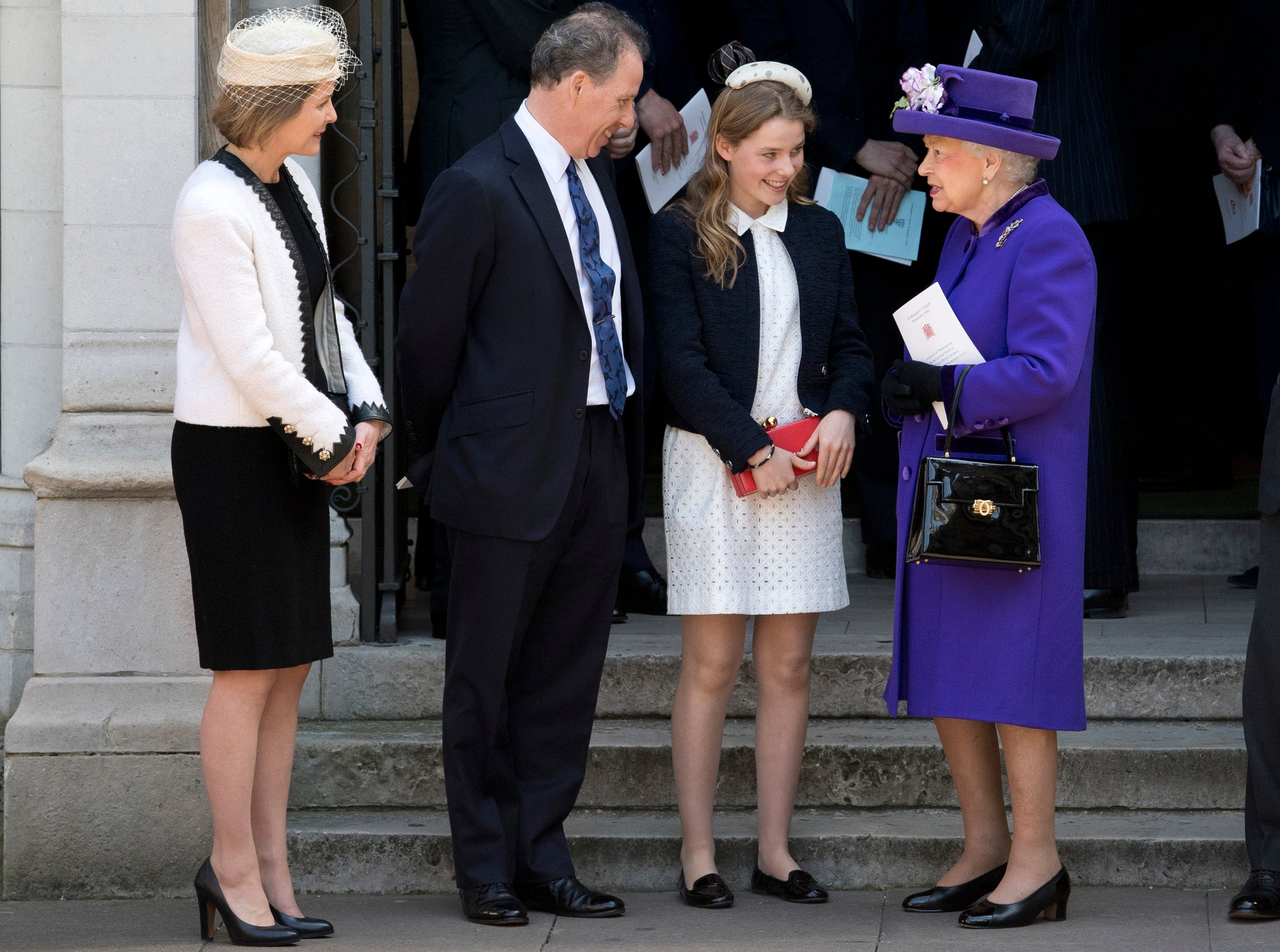 Queen Elizabeth II speaks to (L-R) Serena Armstrong-Jones, David Armstrong-Jones and Margarita Armstrong-Jones as they leave a Service of Thanksgiving for the life and work of Lord Snowdon at Westminster Abbey on April 7, 2017