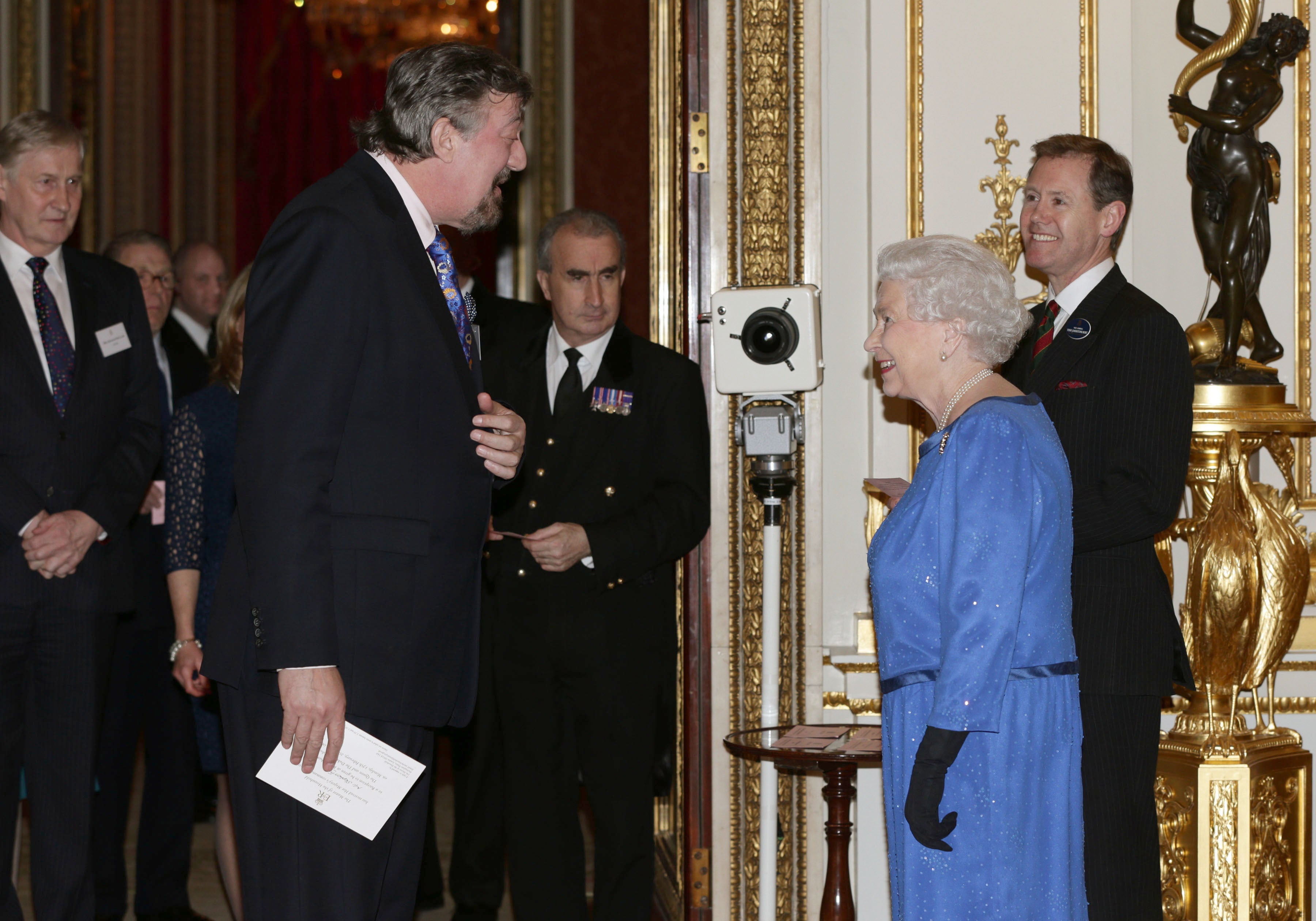 Stephen Fry meets the Queen at Buckingham Palace (PA)