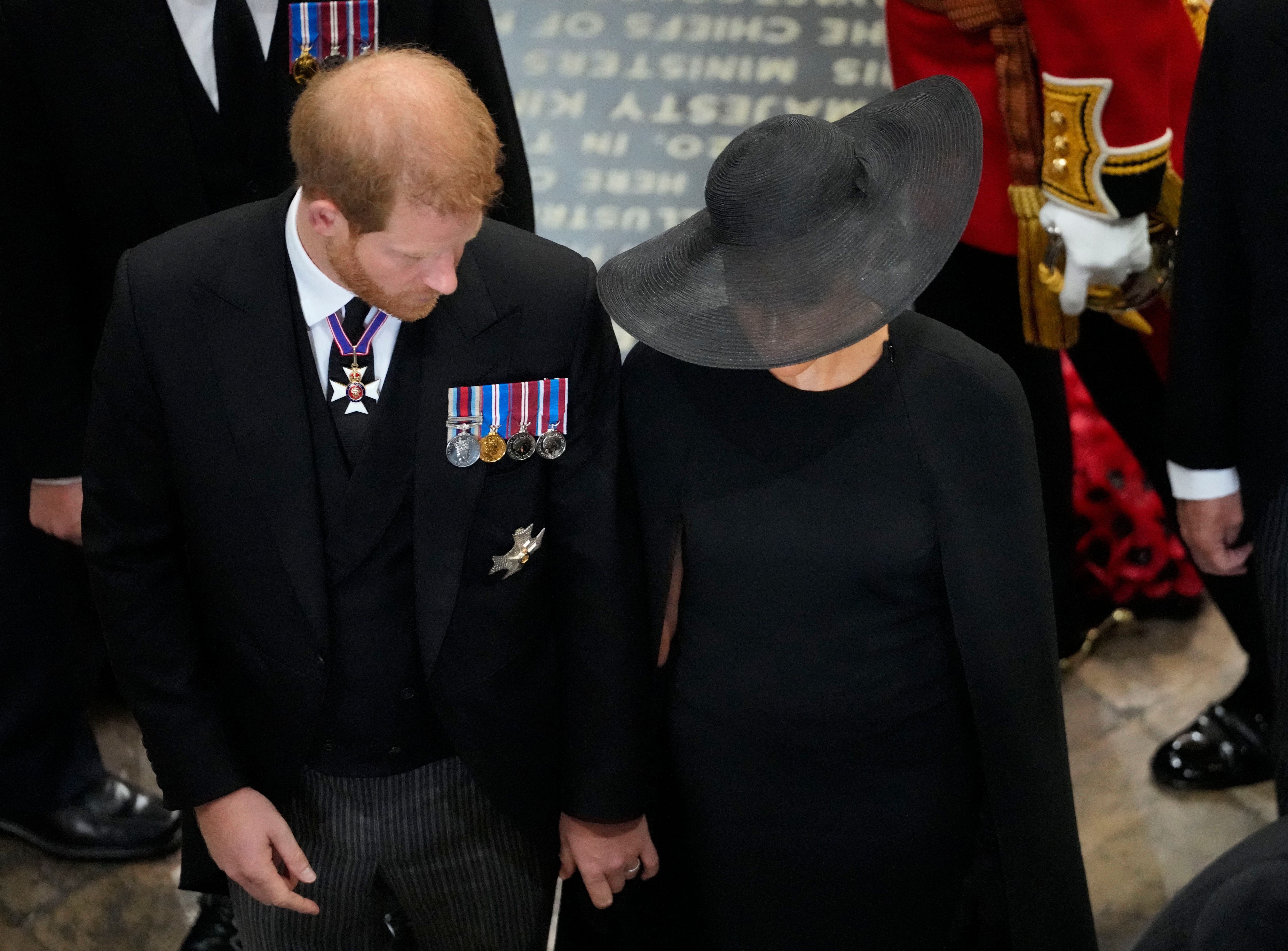 Duchess of Sussex comforts Duke of Sussex during funeral service