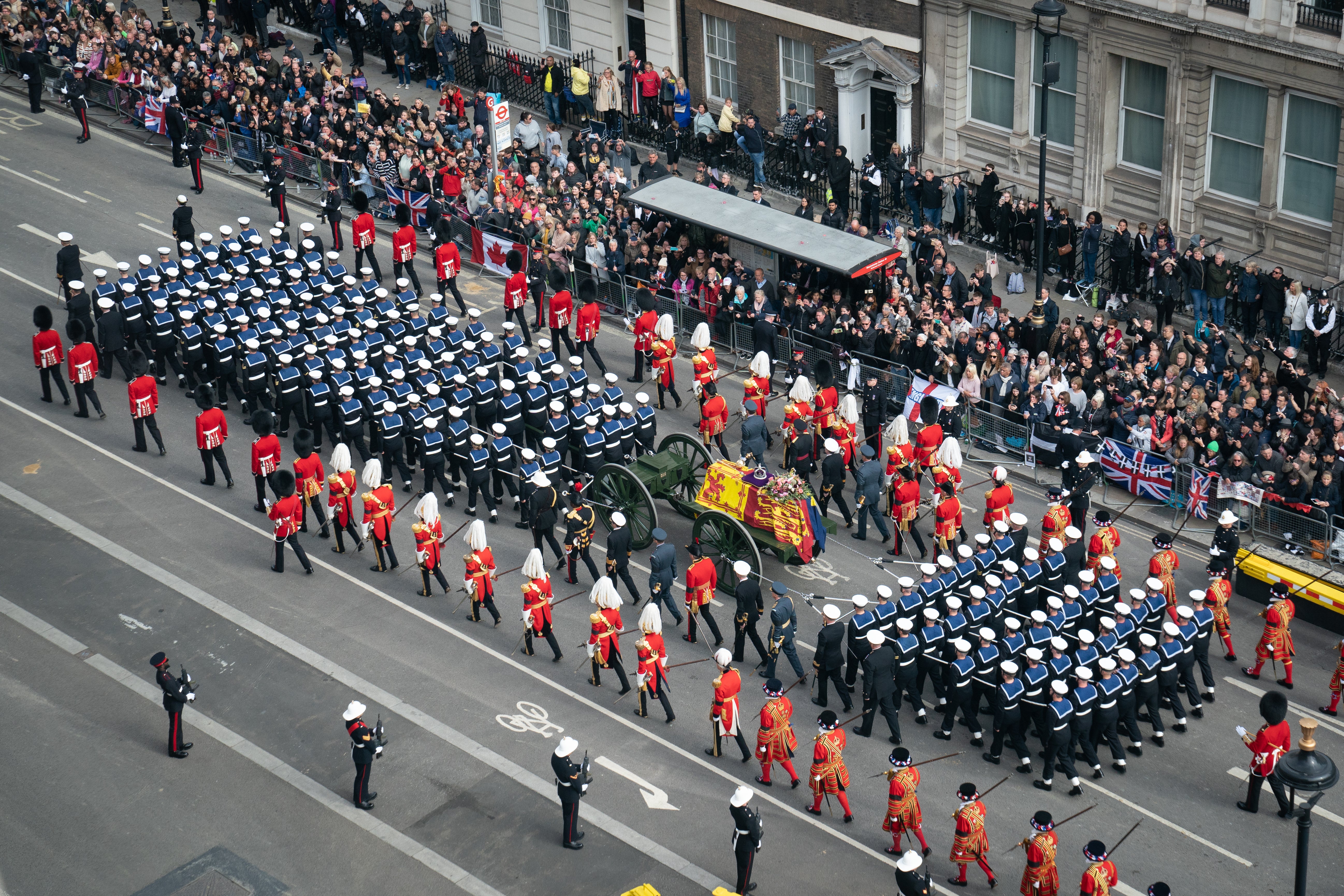 Onlookers watch as the State Gun Carriage carries the Queen’s coffin (Stefan Rousseau/PA)