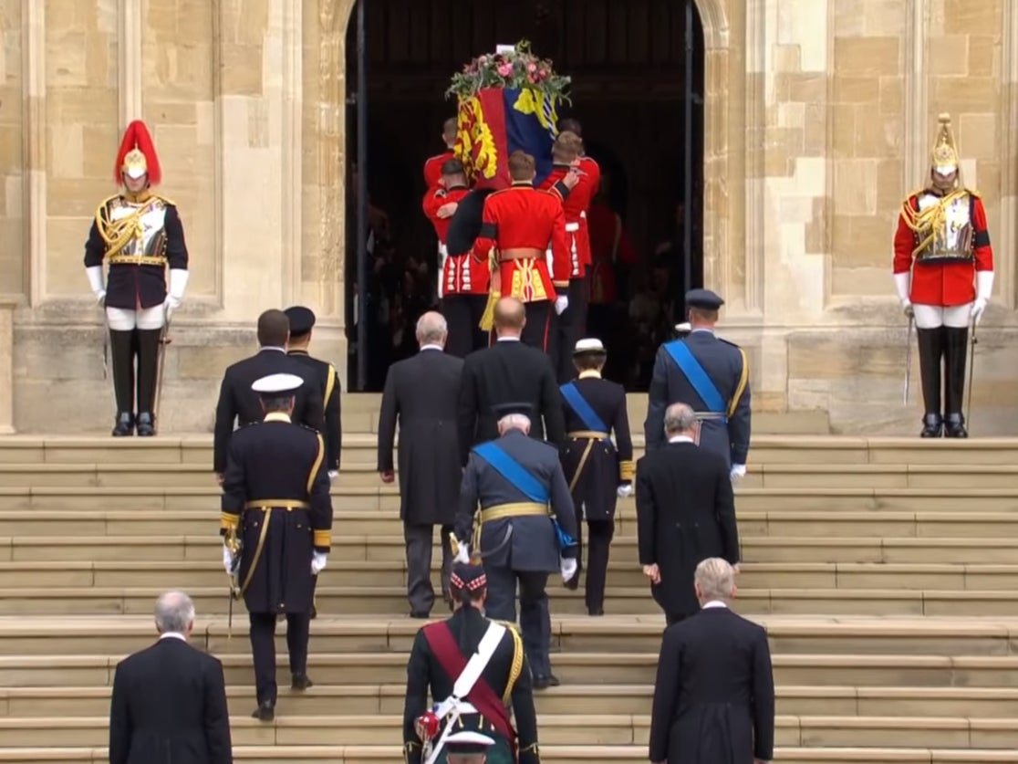 The Queen’s coffin being carried up the chapel’s stairs